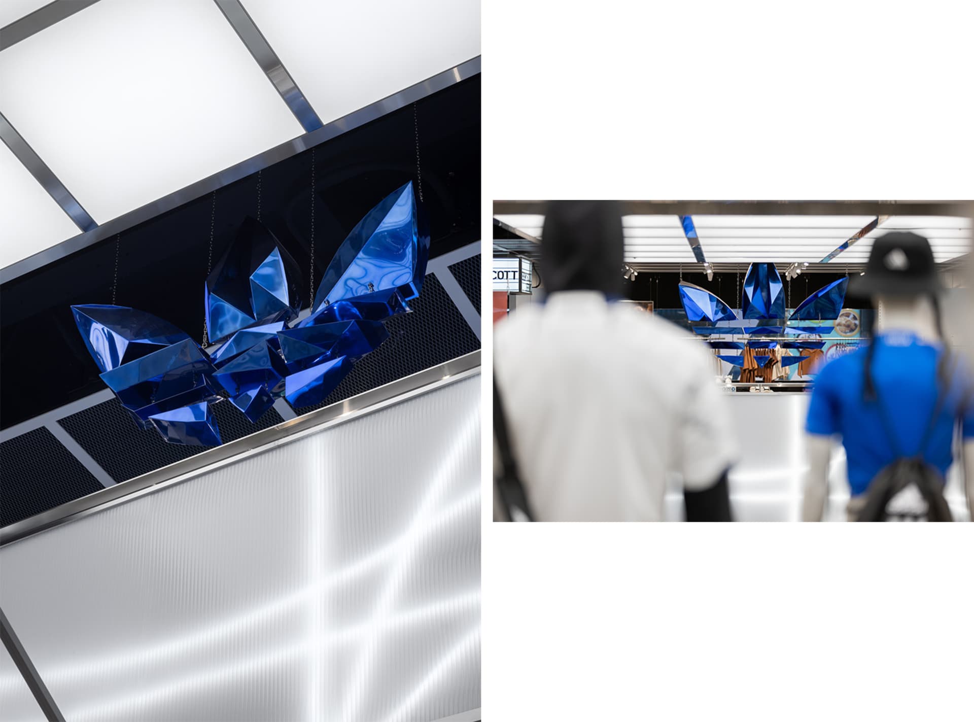 Modern retail space with blue metallic geometric shapes hanging from the ceiling.