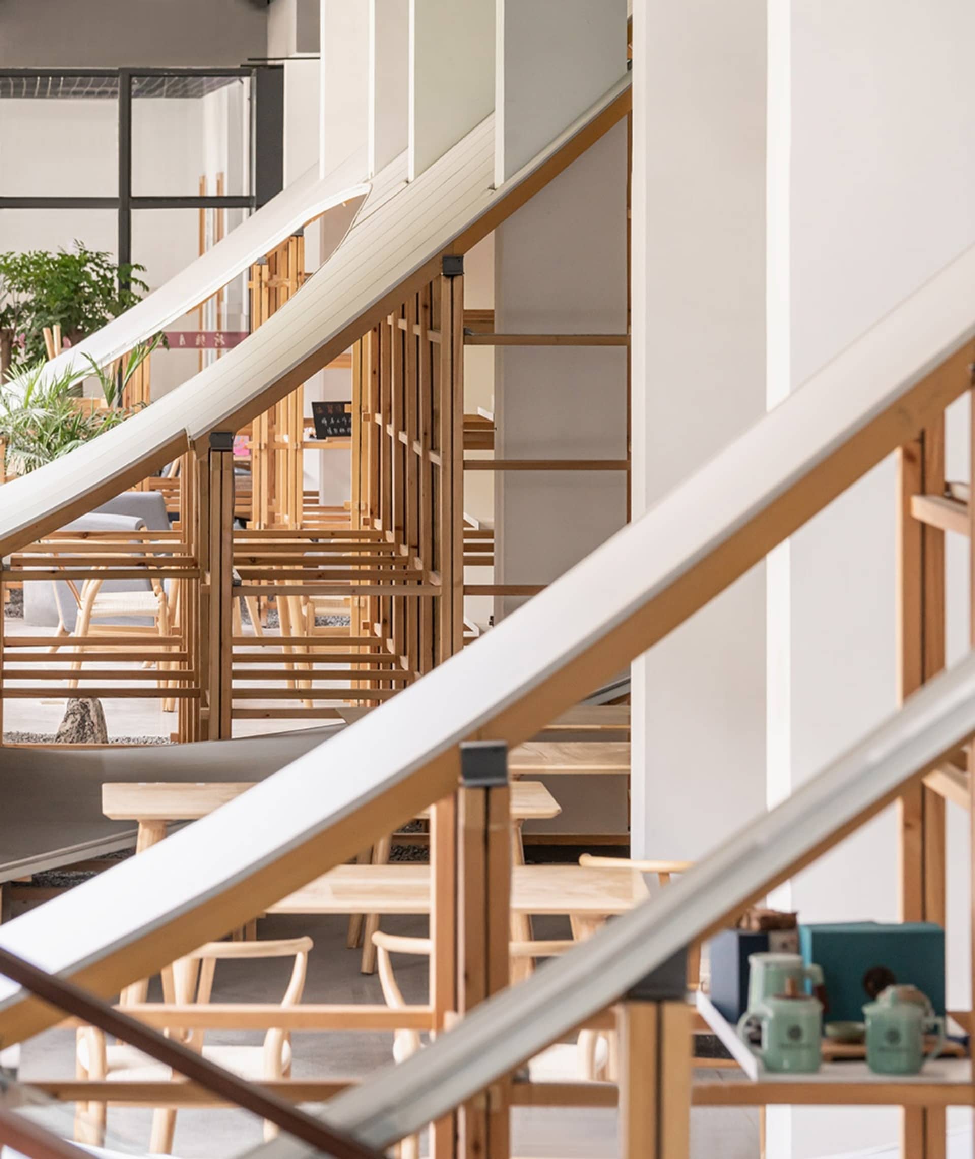 Modern cafe interior featuring wooden furniture and minimalistic design
