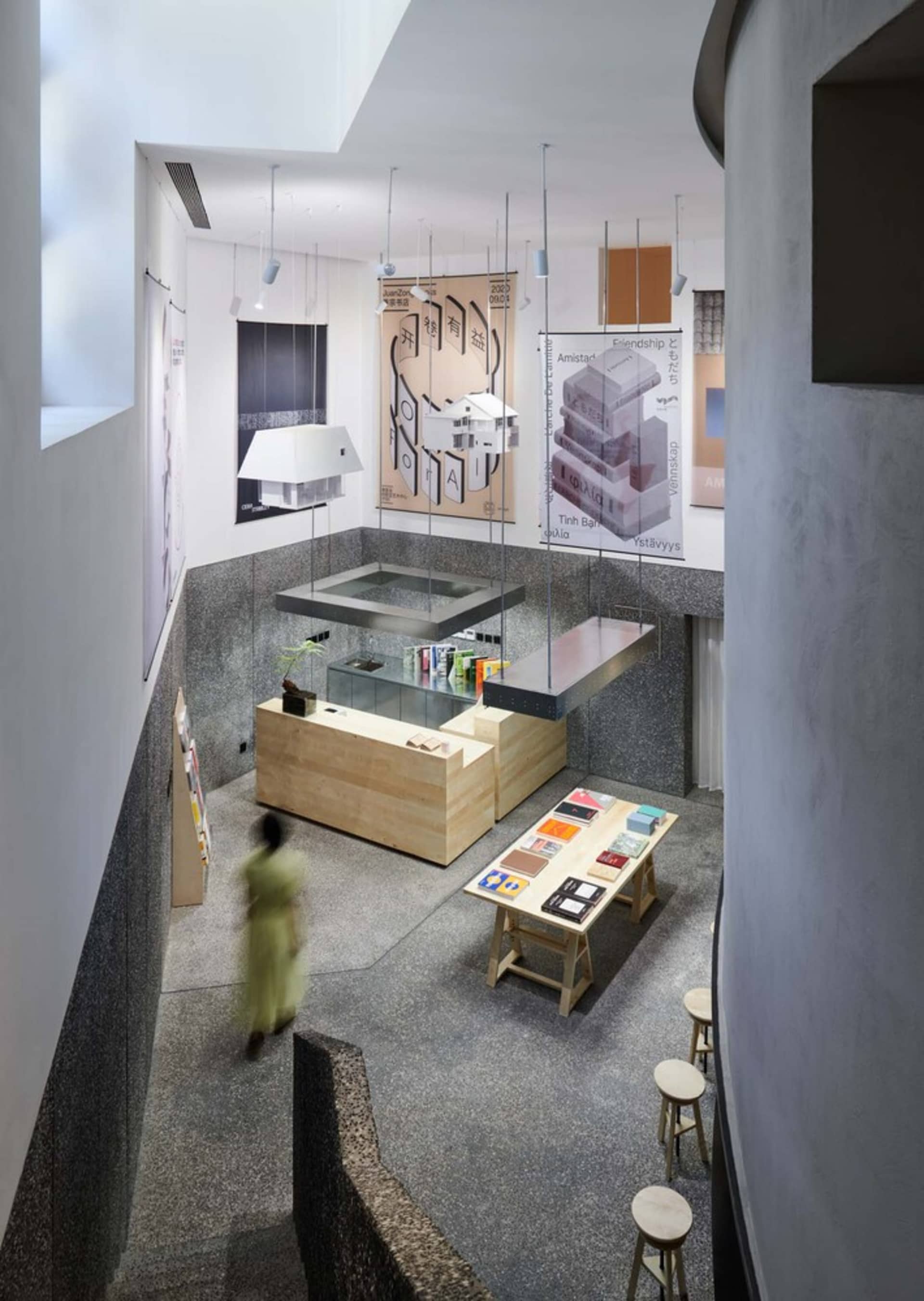 A modern retail shop with a glass countertop, featuring an open space layout and minimalist design.