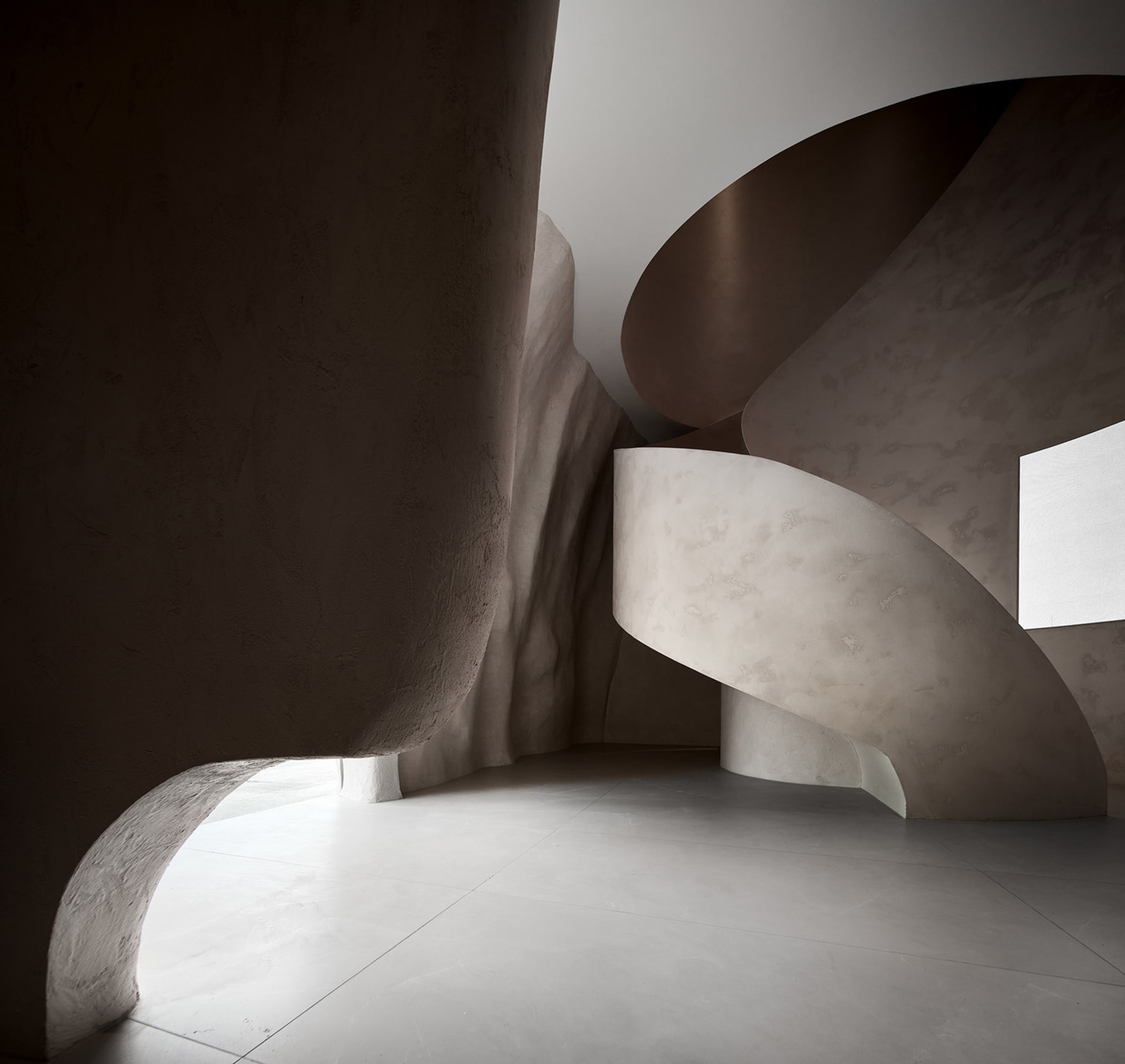 A modern interior design featuring concrete elements and sleek, minimalist lines.
