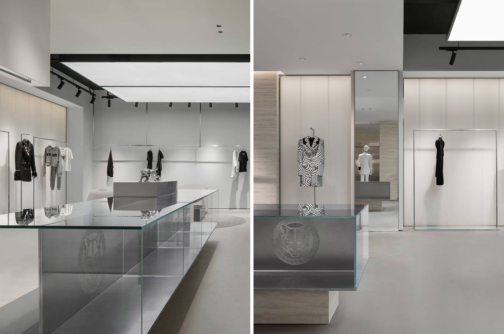 A modern retail interior with glass displays, concrete surfaces, and metal accents.