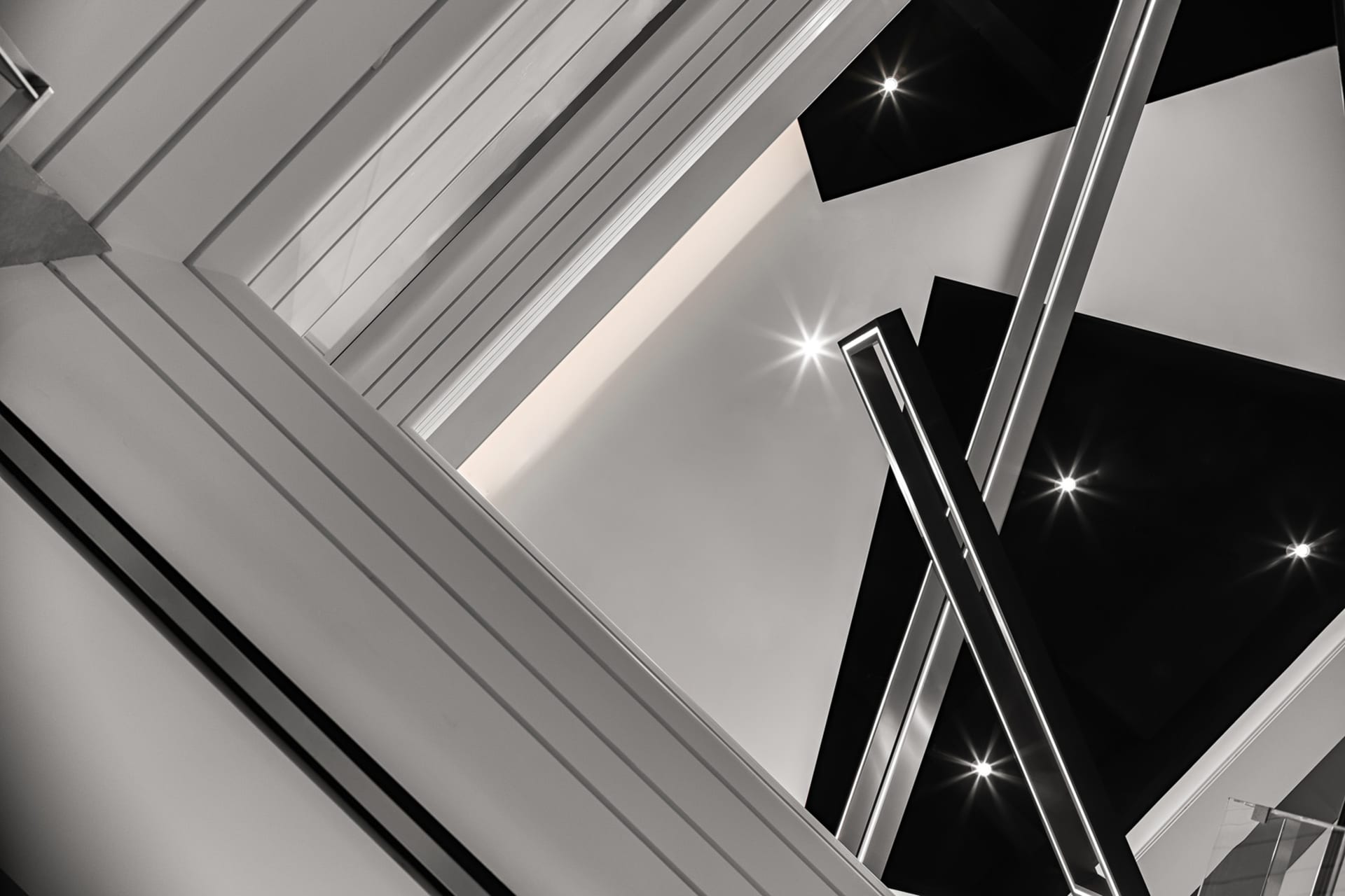 Modern indoor space featuring glass and metal architectural elements.