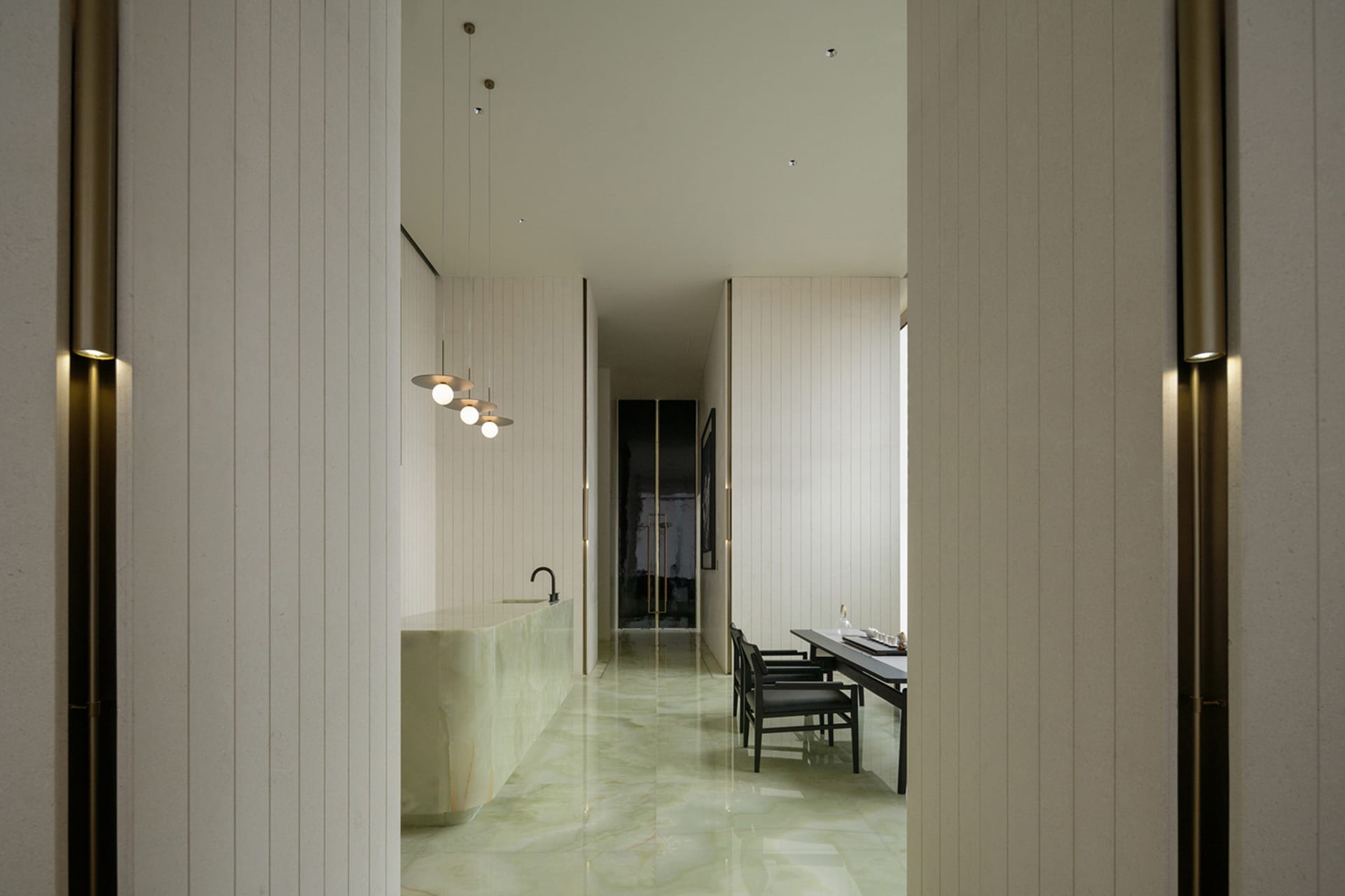 A minimalist kitchen with a white marble countertop and floor.