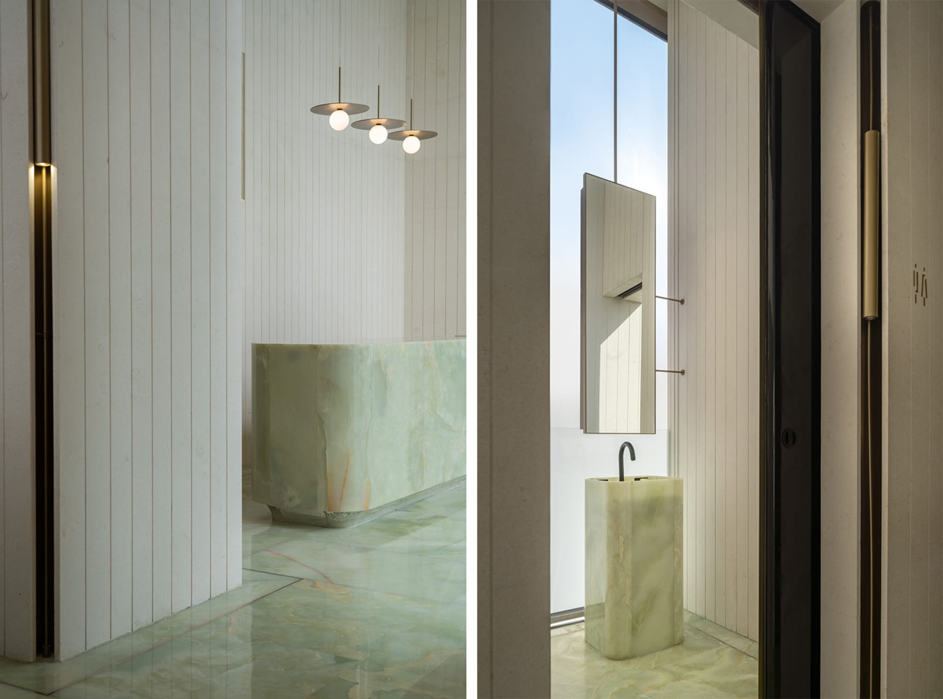 A modern bathroom with minimalist design, featuring marble fixtures and floor-to-ceiling windows.