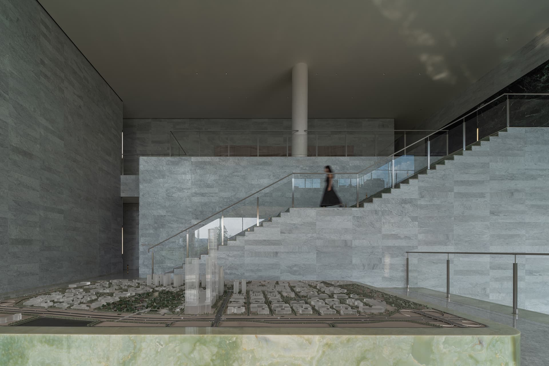 Modern interior space with marble finishes and concrete elements.
