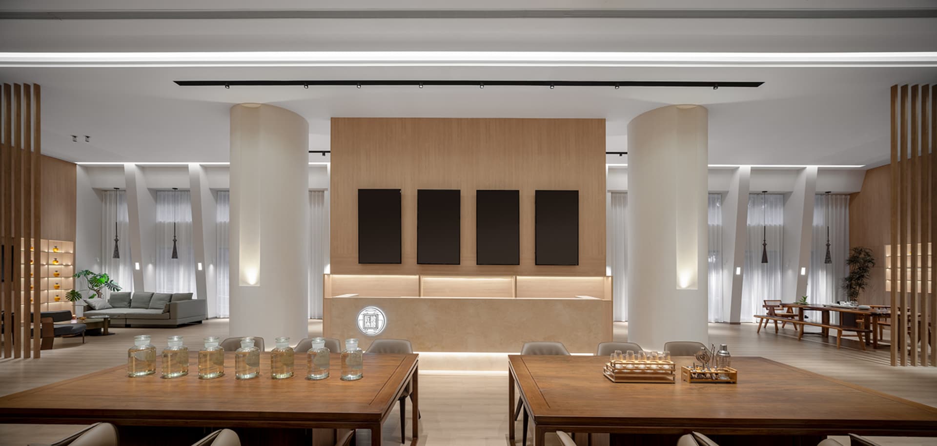 Modern hotel lobby featuring wooden accents and a minimalist design.