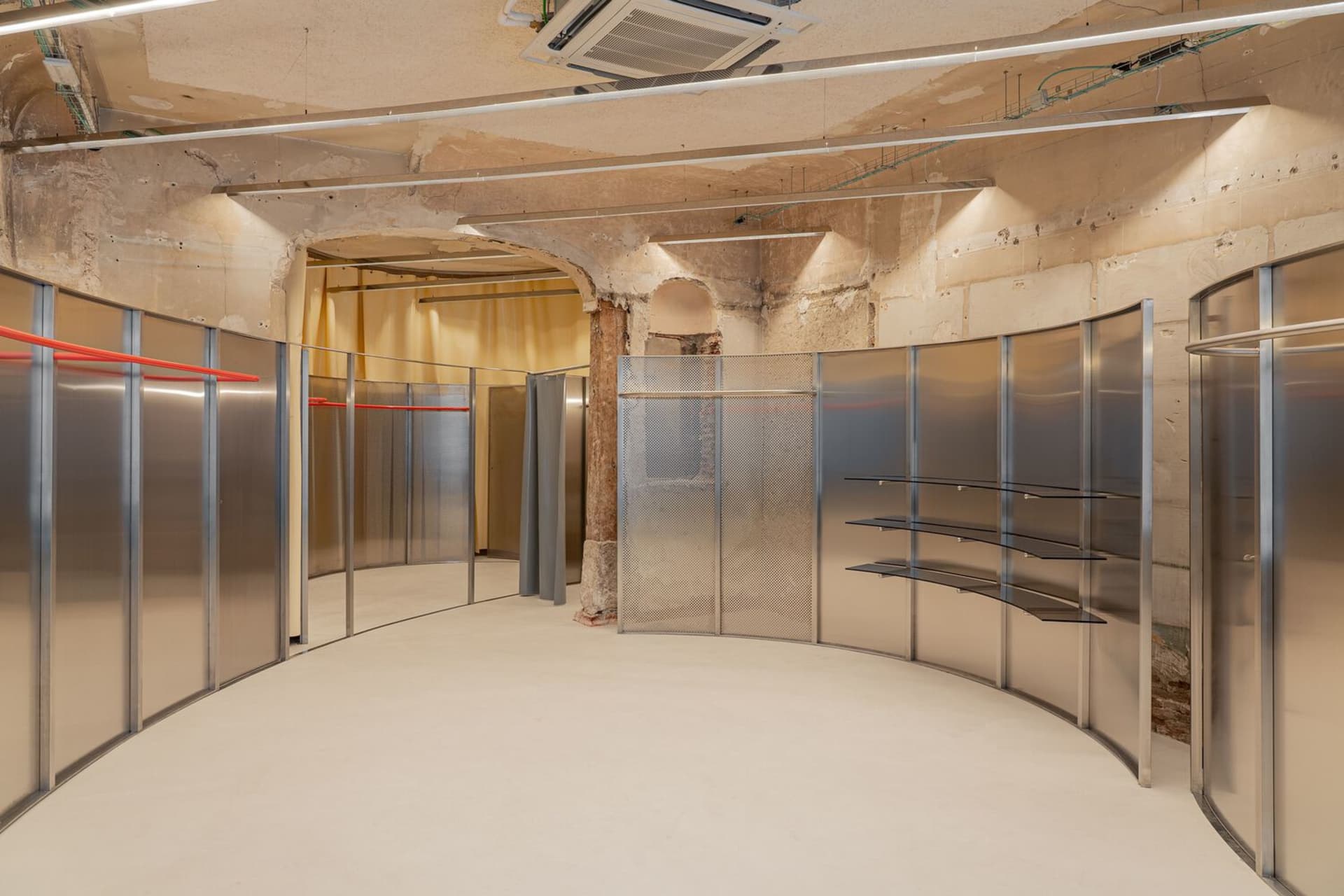 A modern retail shop with metal panels and glass elements