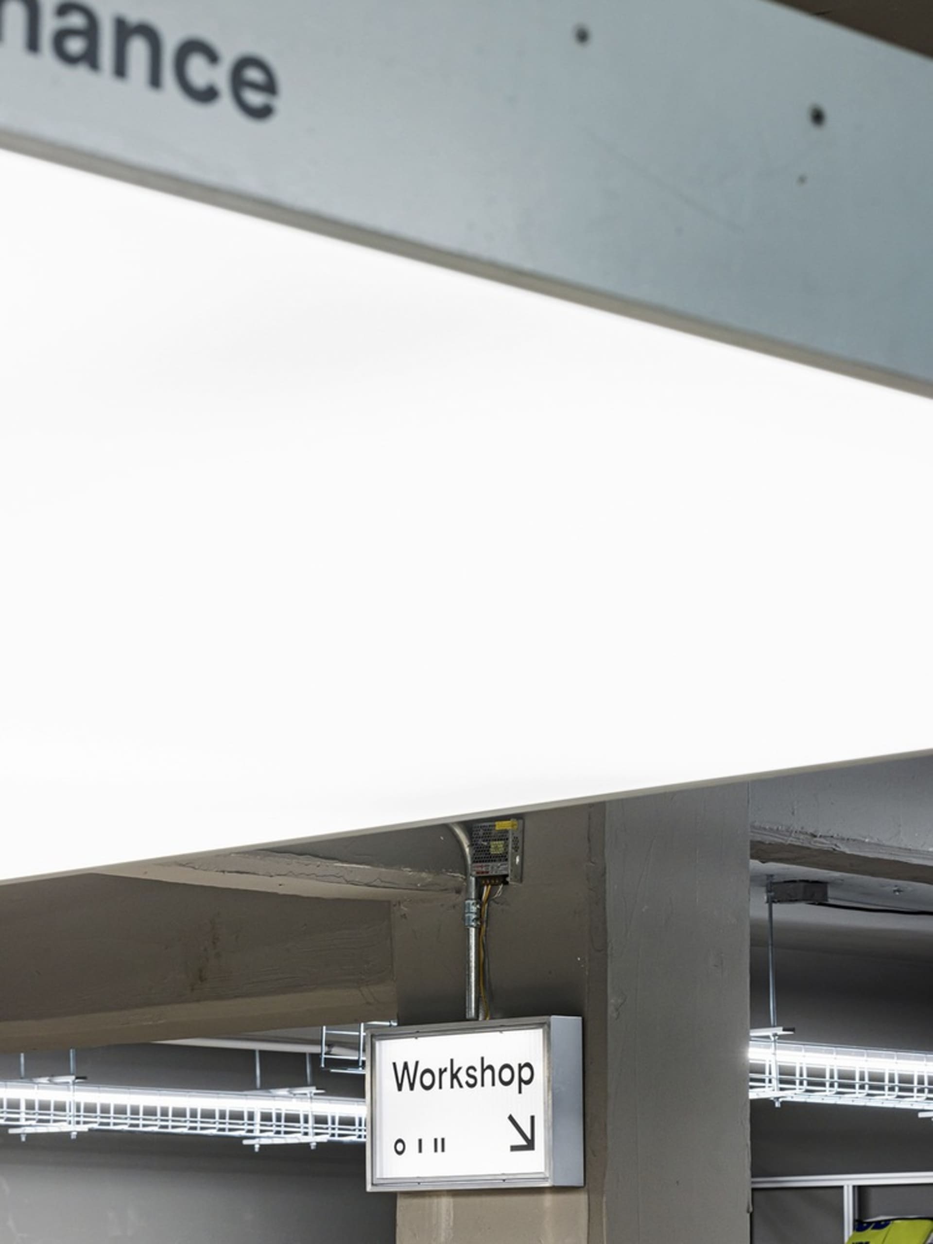 Interior design of an industrial-style workspace featuring modern lighting solutions.