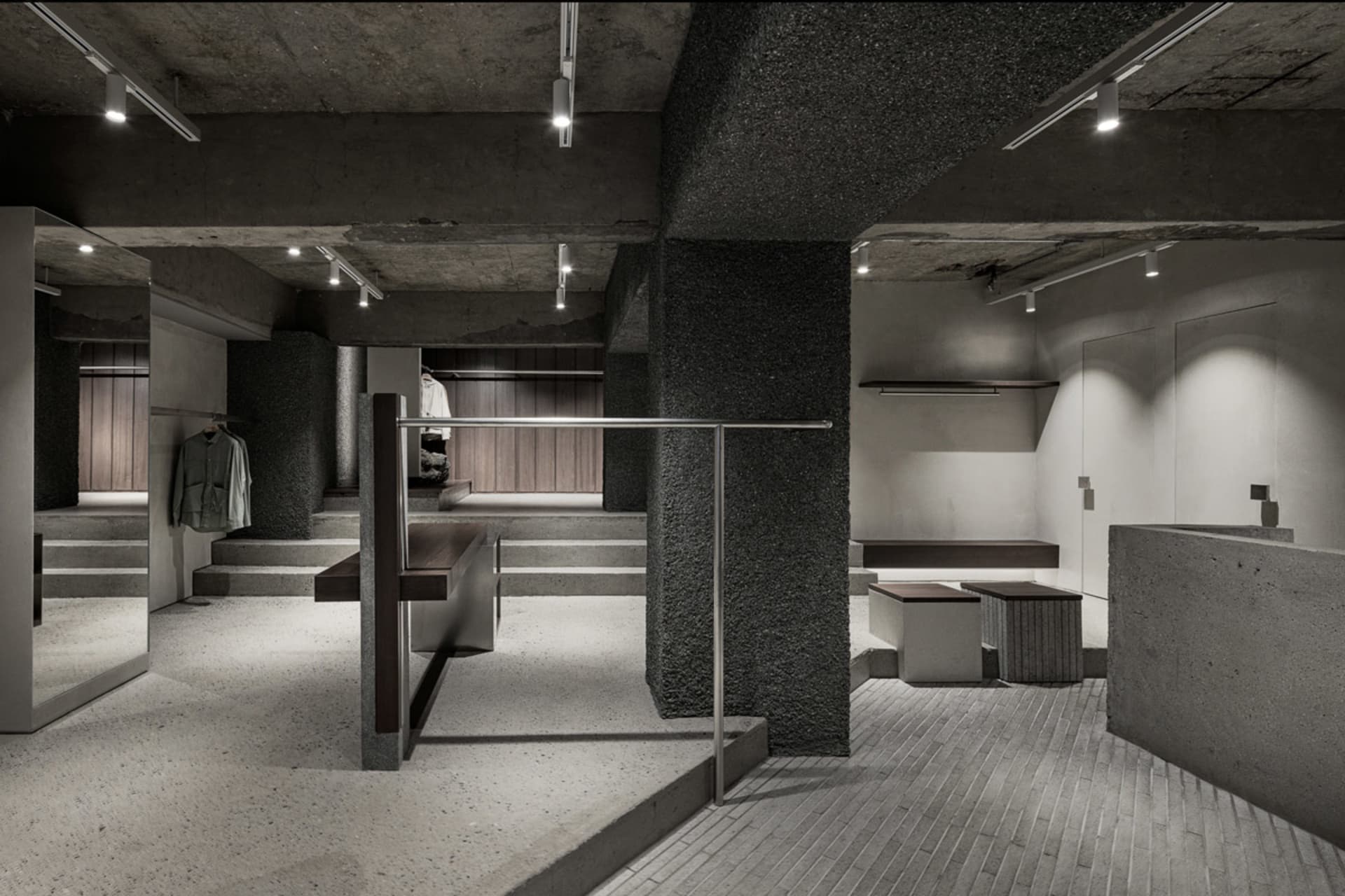 Modern retail store with concrete finishes and industrial design elements.