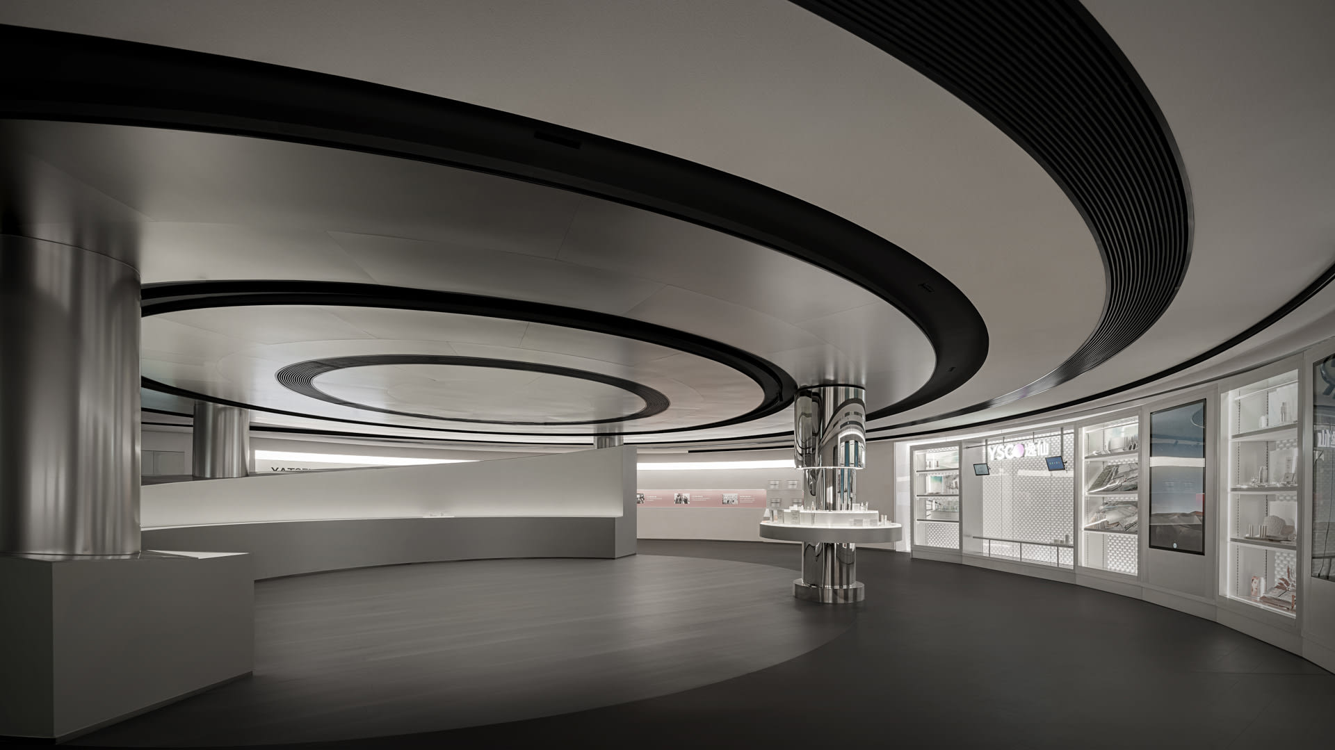 Modern retail space featuring industrial materials such as metal, concrete, and glass.