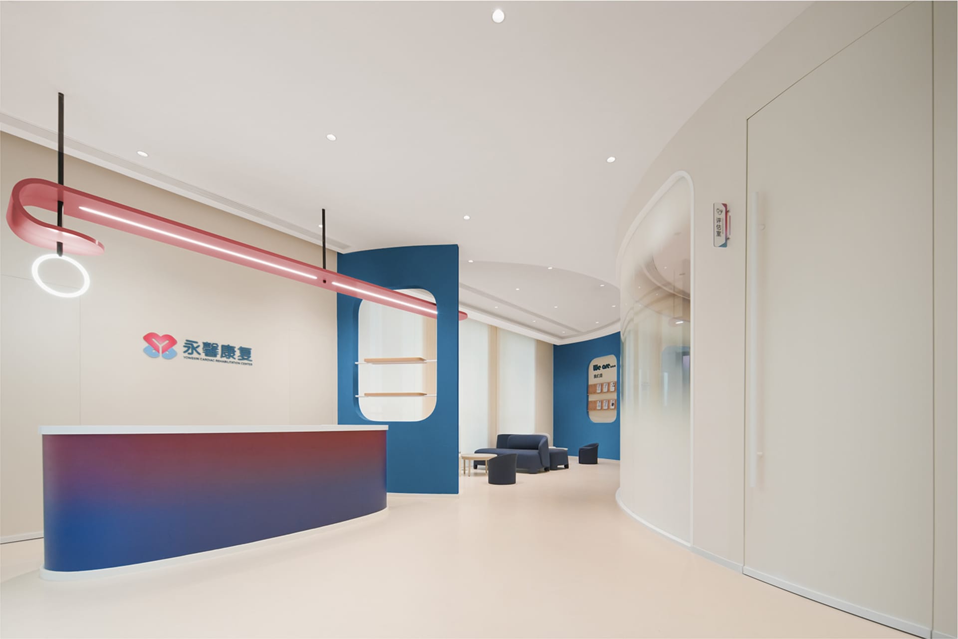 A modern commercial interior featuring a sleek, multi-colored reception desk with a contemporary design.