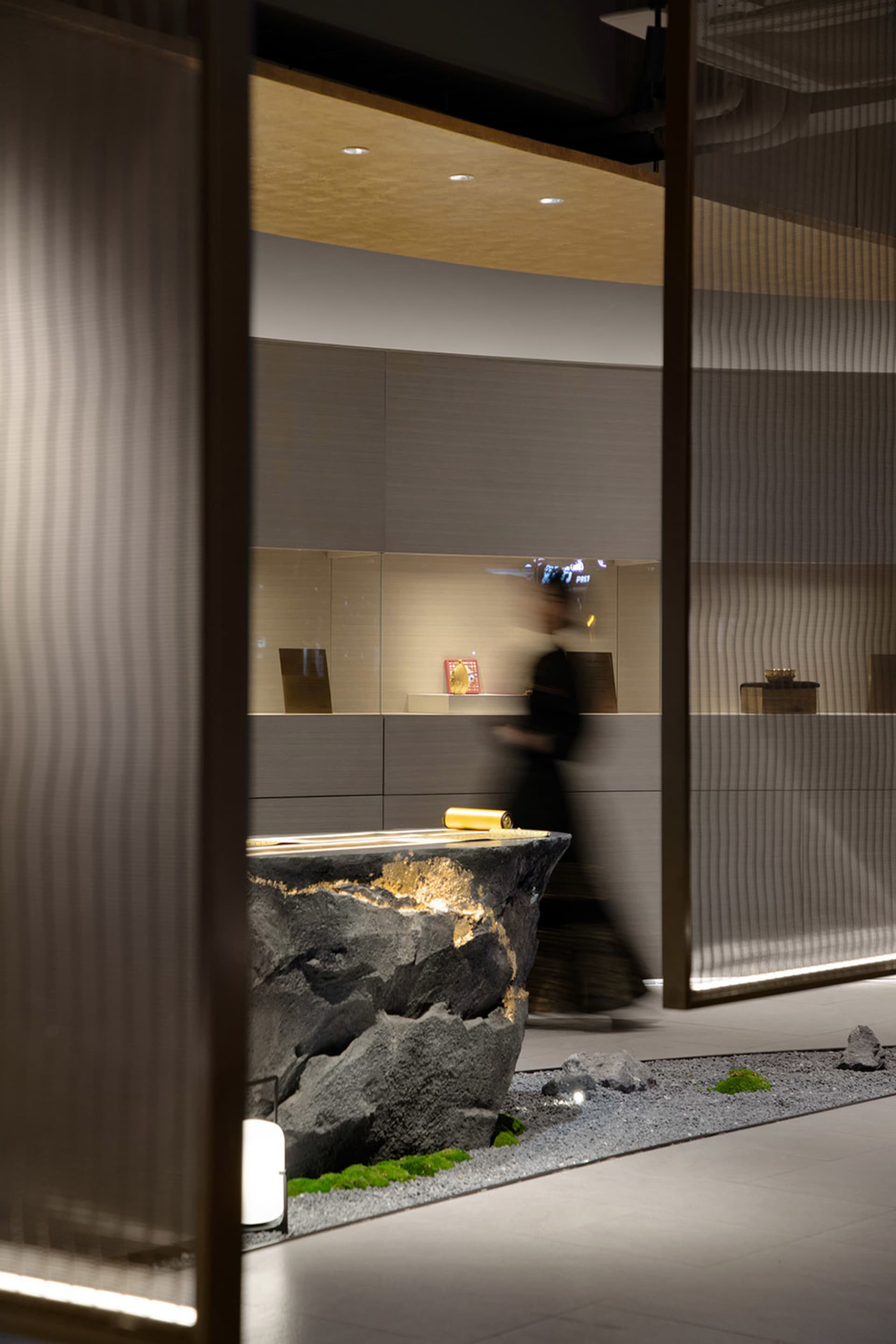Minimalist interior design featuring concrete and rock elements