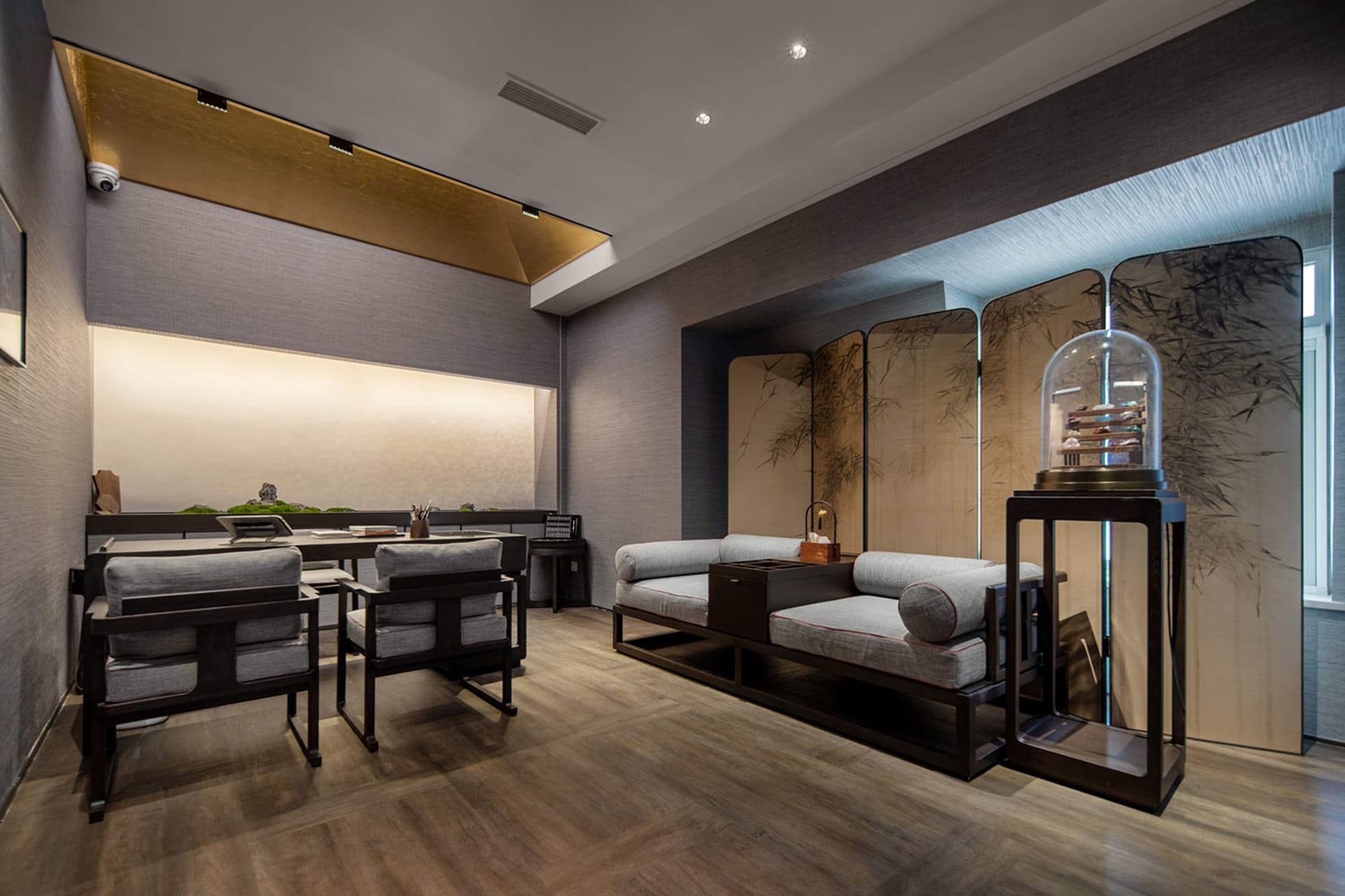 Modern living room featuring wooden furniture, fabric seating, and glass elements