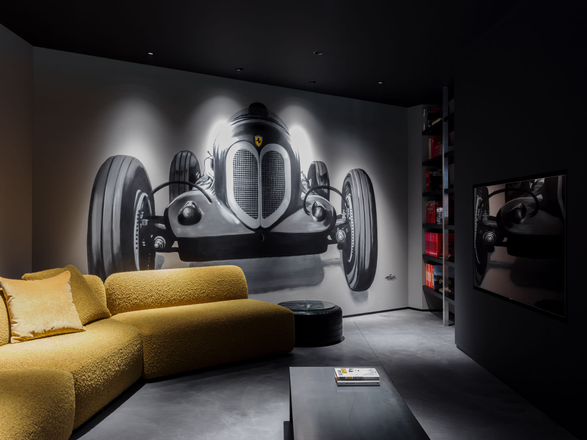 Industrially designed living room featuring a concrete floor, a yellow sofa, and a large black-and-white mural of a classic c