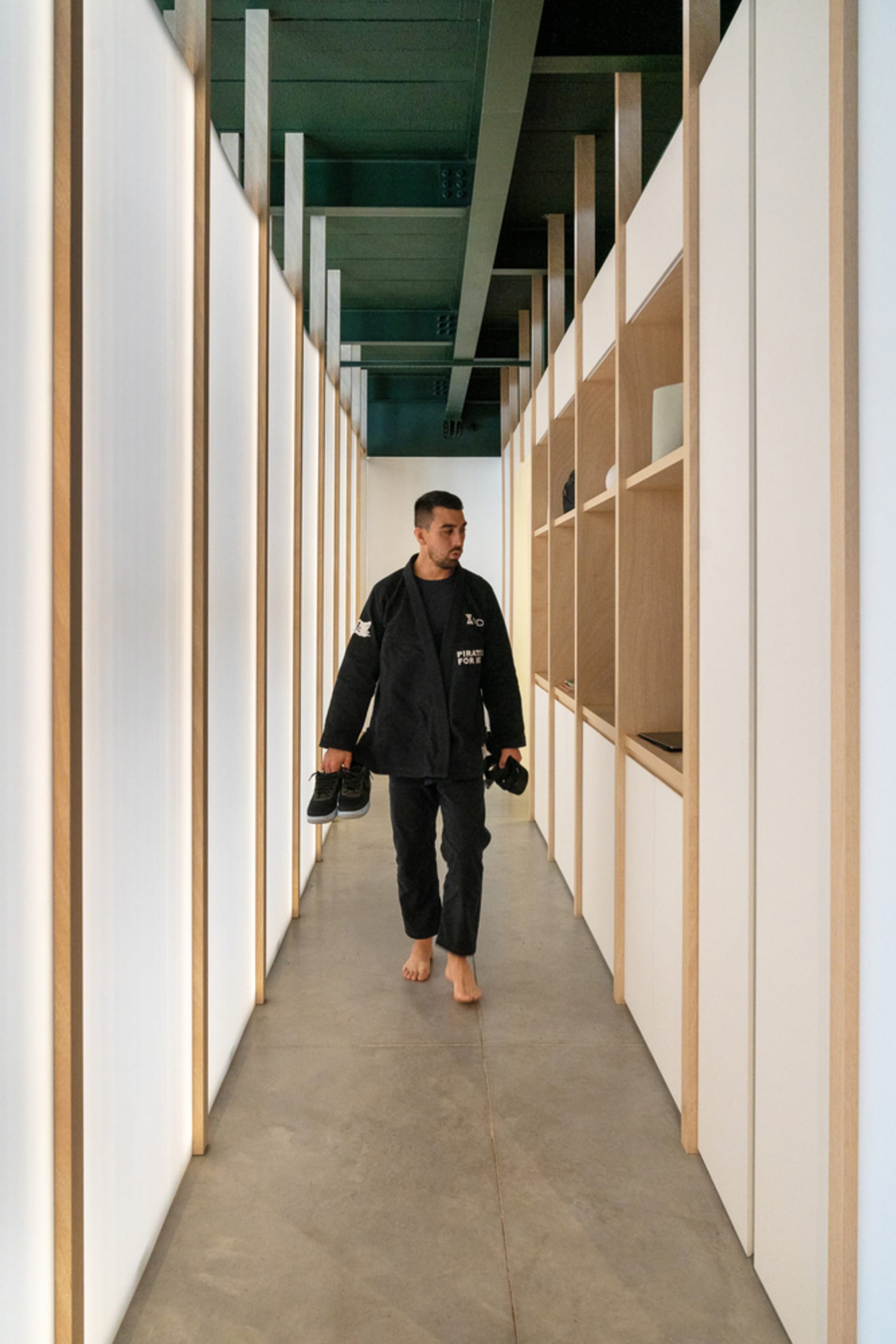 A minimalist design featuring exposed concrete walls and floor in an architectural interior space.