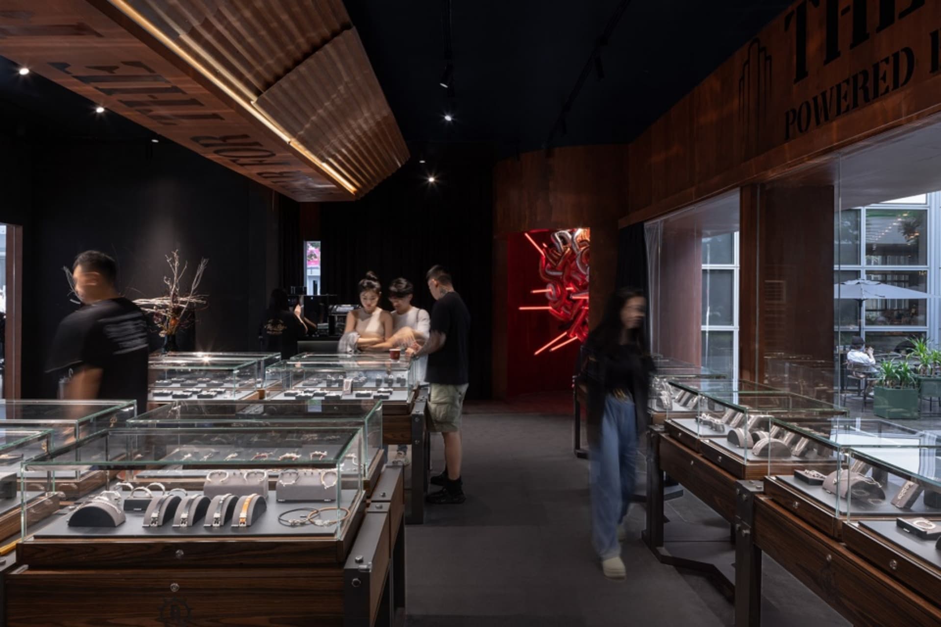 A minimalist jewelry store with glass counters, showcasing a variety of jewelry.