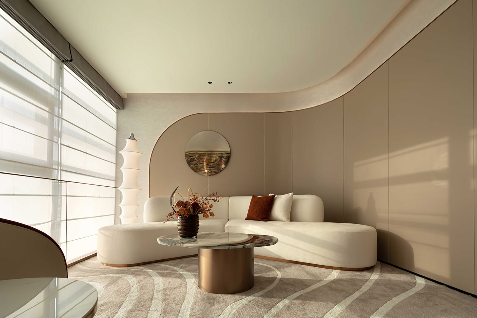 A modern living room with a marble and leather furniture set