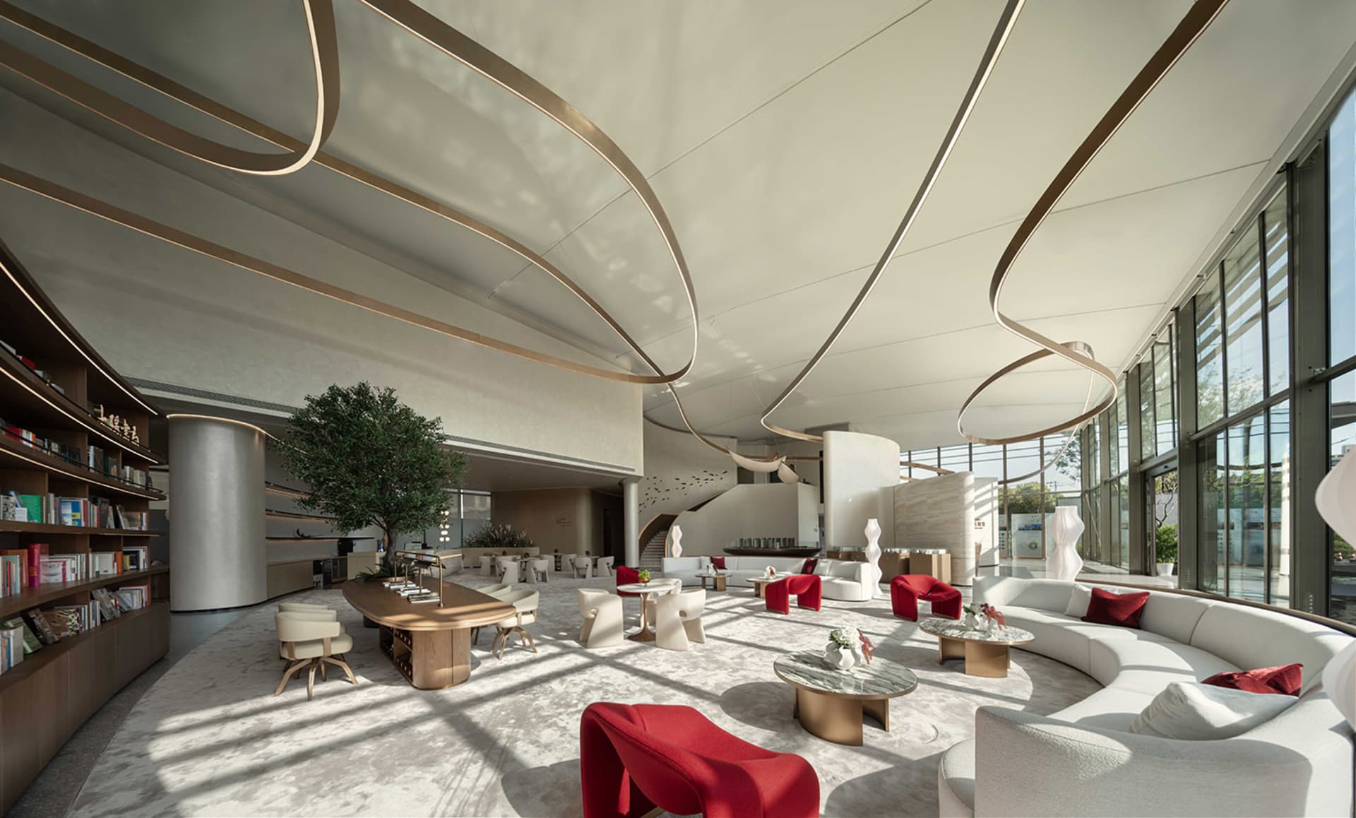Modern hotel lobby with white furniture and glass walls