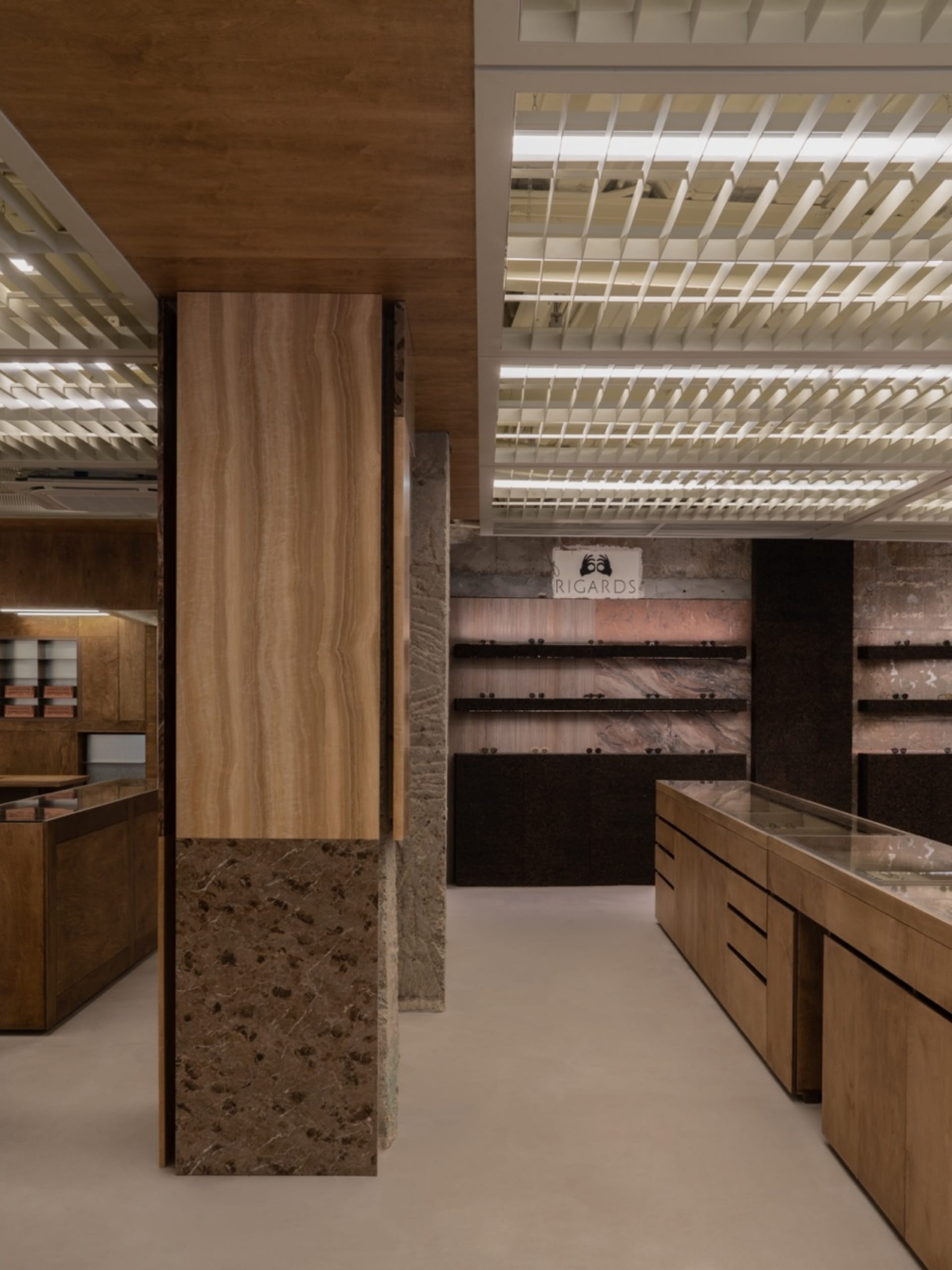 A modern retail shop featuring marble and wood elements.