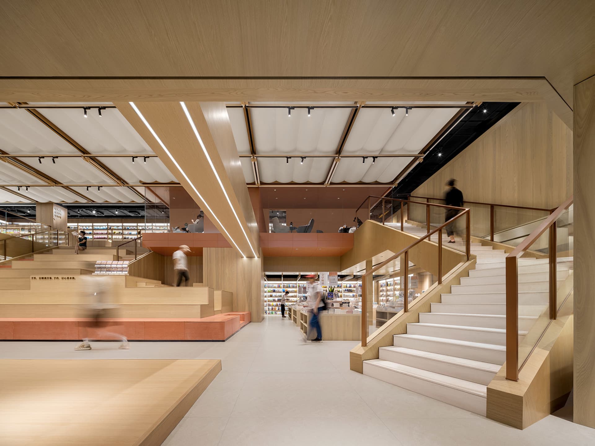 A modern bookstore interior with wooden elements and a contemporary design.