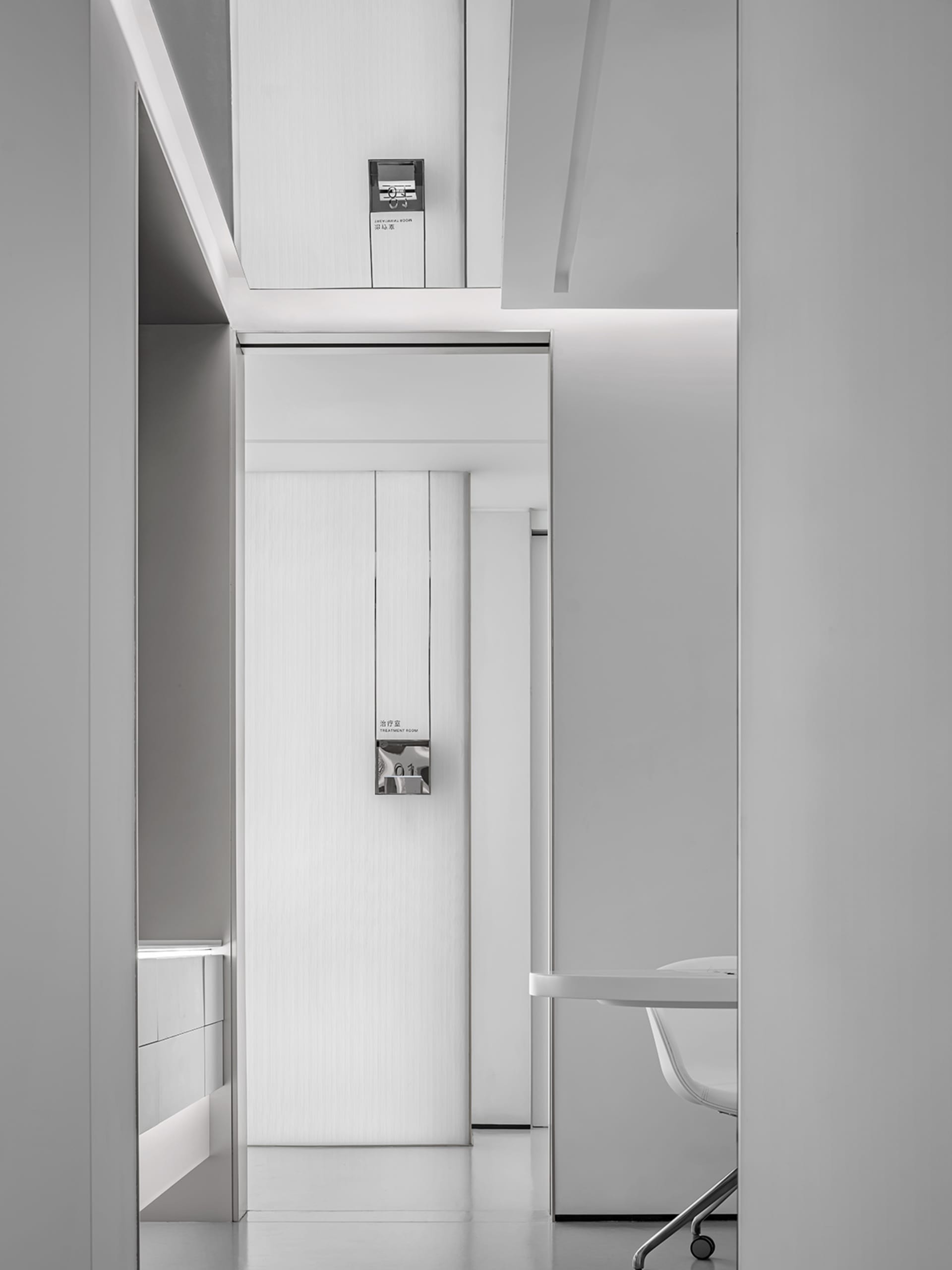 Minimalist hospitality interior featuring sleek, neutral-colored design elements.