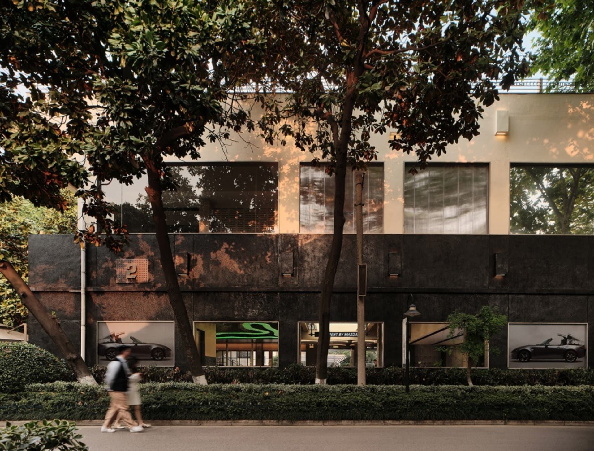 Modern storefront featuring a concrete exterior and large windows