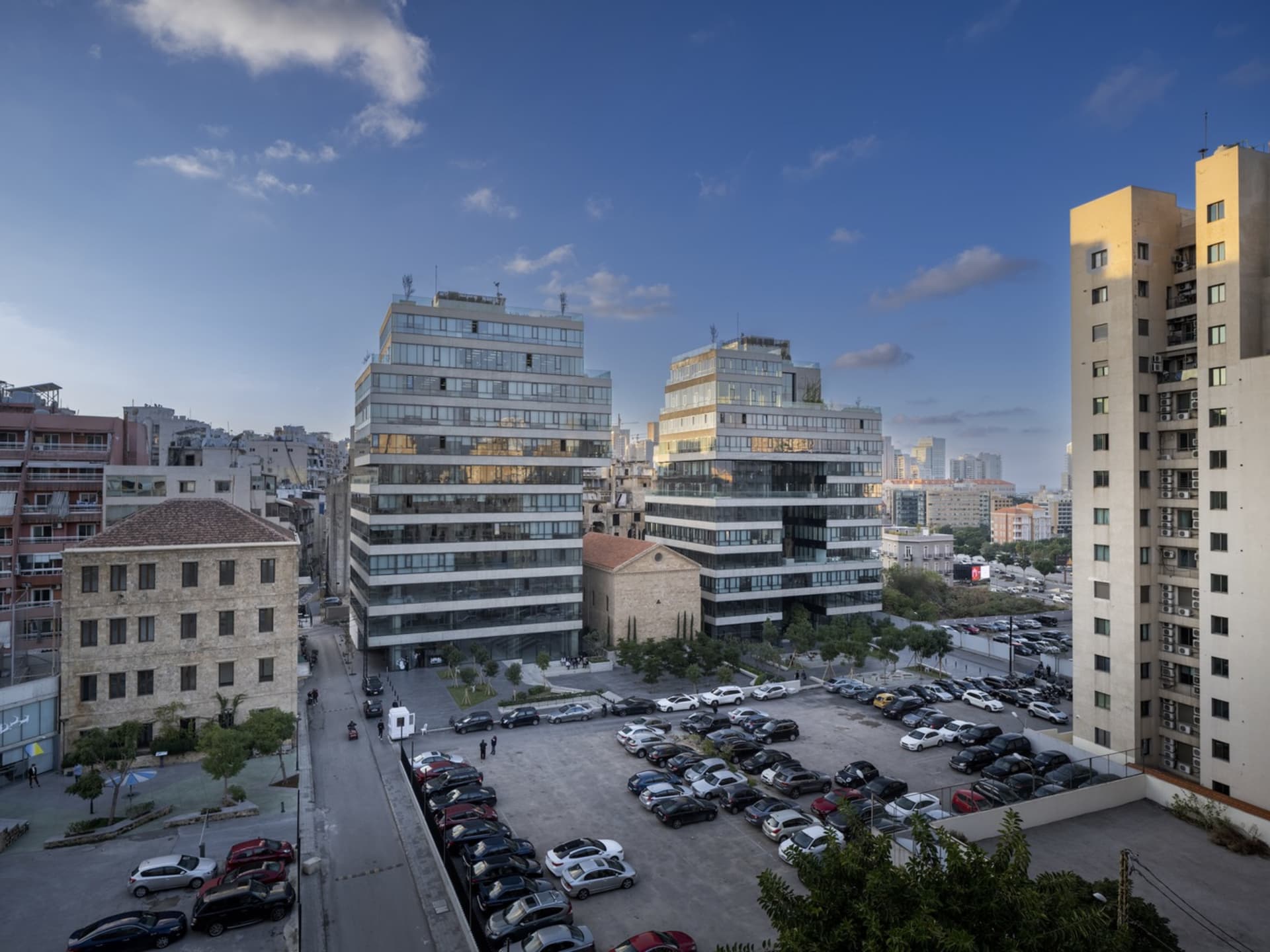 A comprehensive urban development view showcasing a mix of modern concrete and glass architectural designs within a bustling