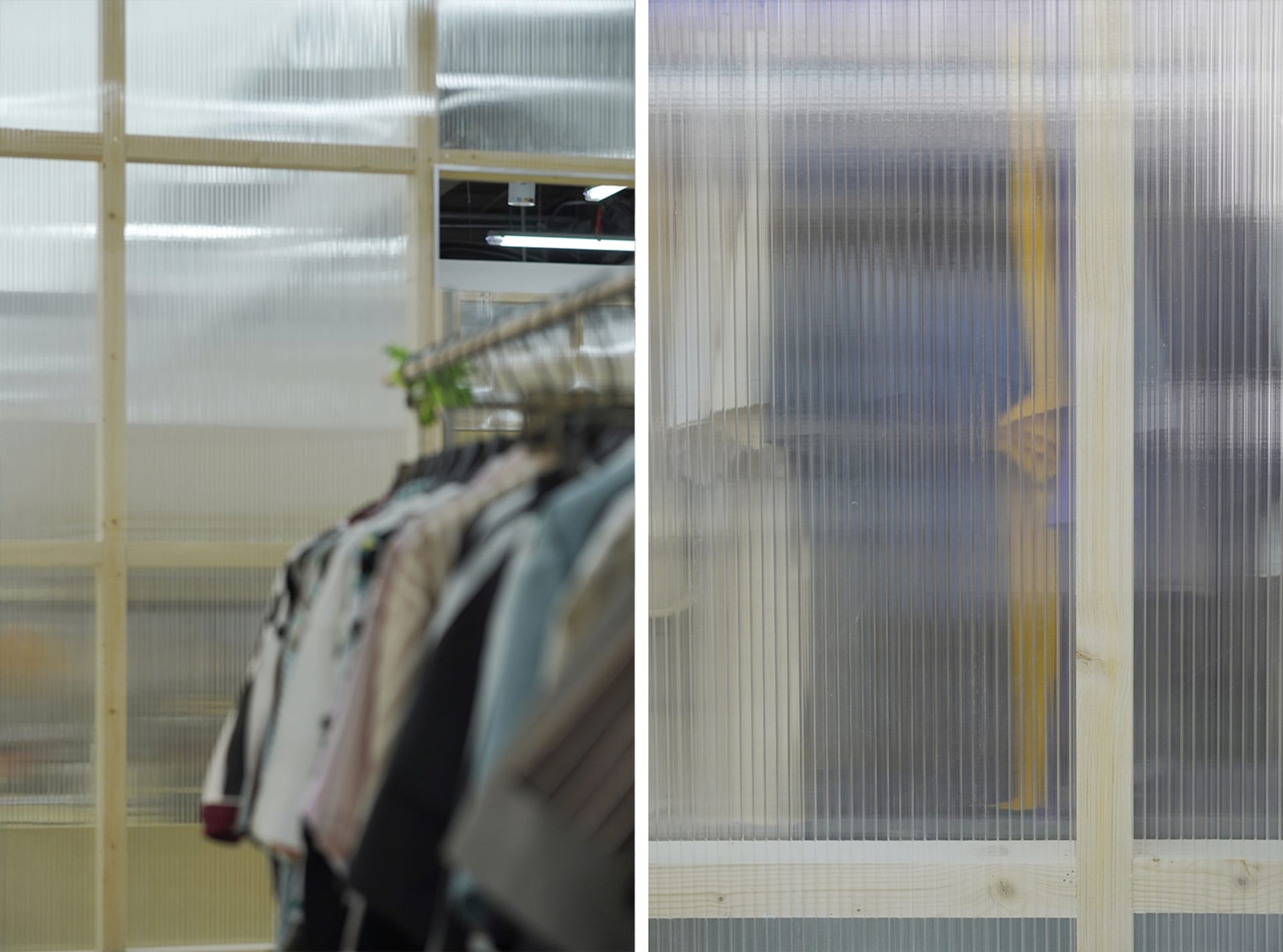 A row of clothing hanging on a transparent plastic clothing rack.