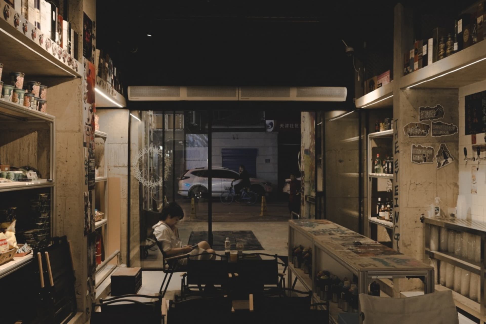 Industrial-style cafe interior with concrete walls and minimalist furniture