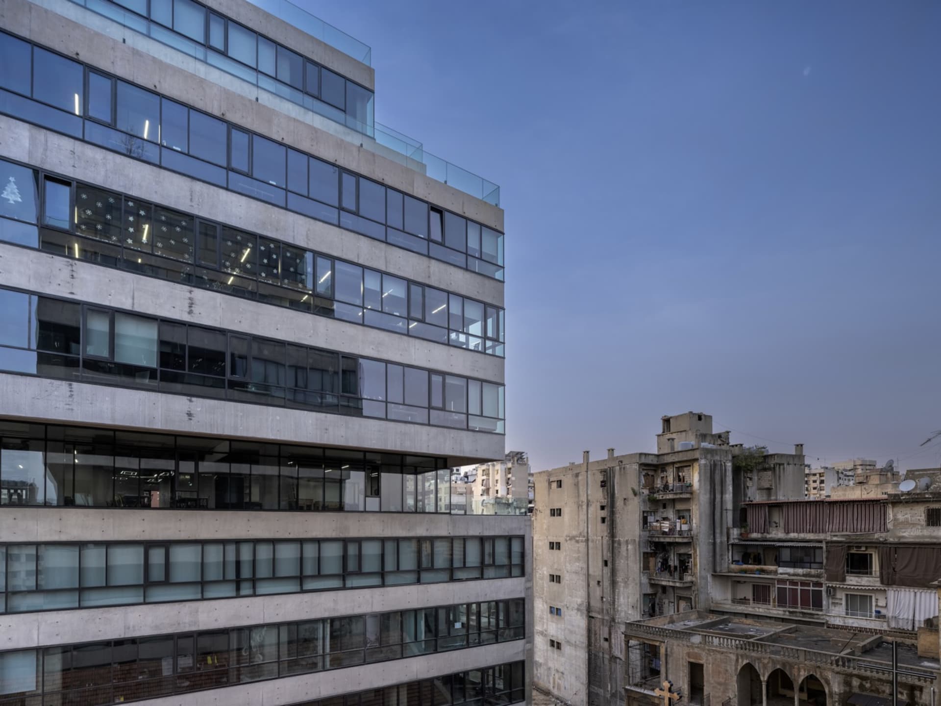 A modern high-rise building constructed primarily of concrete and glass.