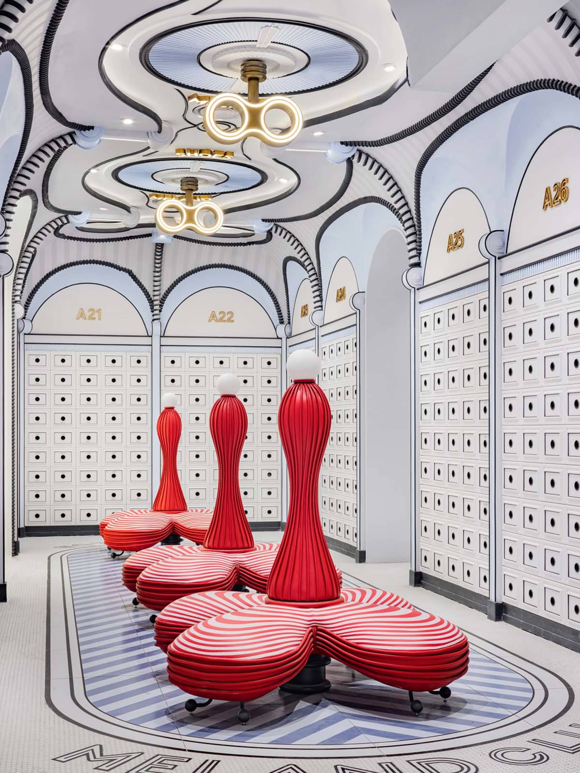 Modern retail shop interior with red and white striped plastic seating and metalacking columns