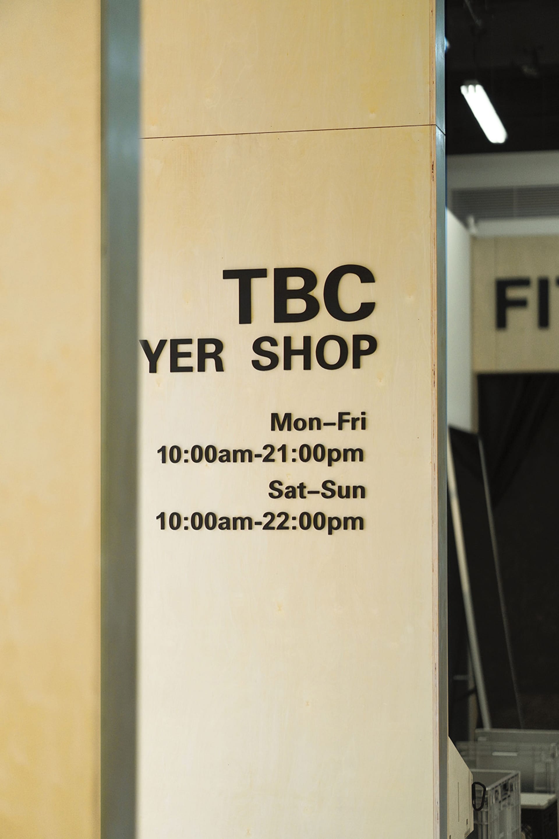 A signboard displaying the TBC Yer Shop name and operating hours.