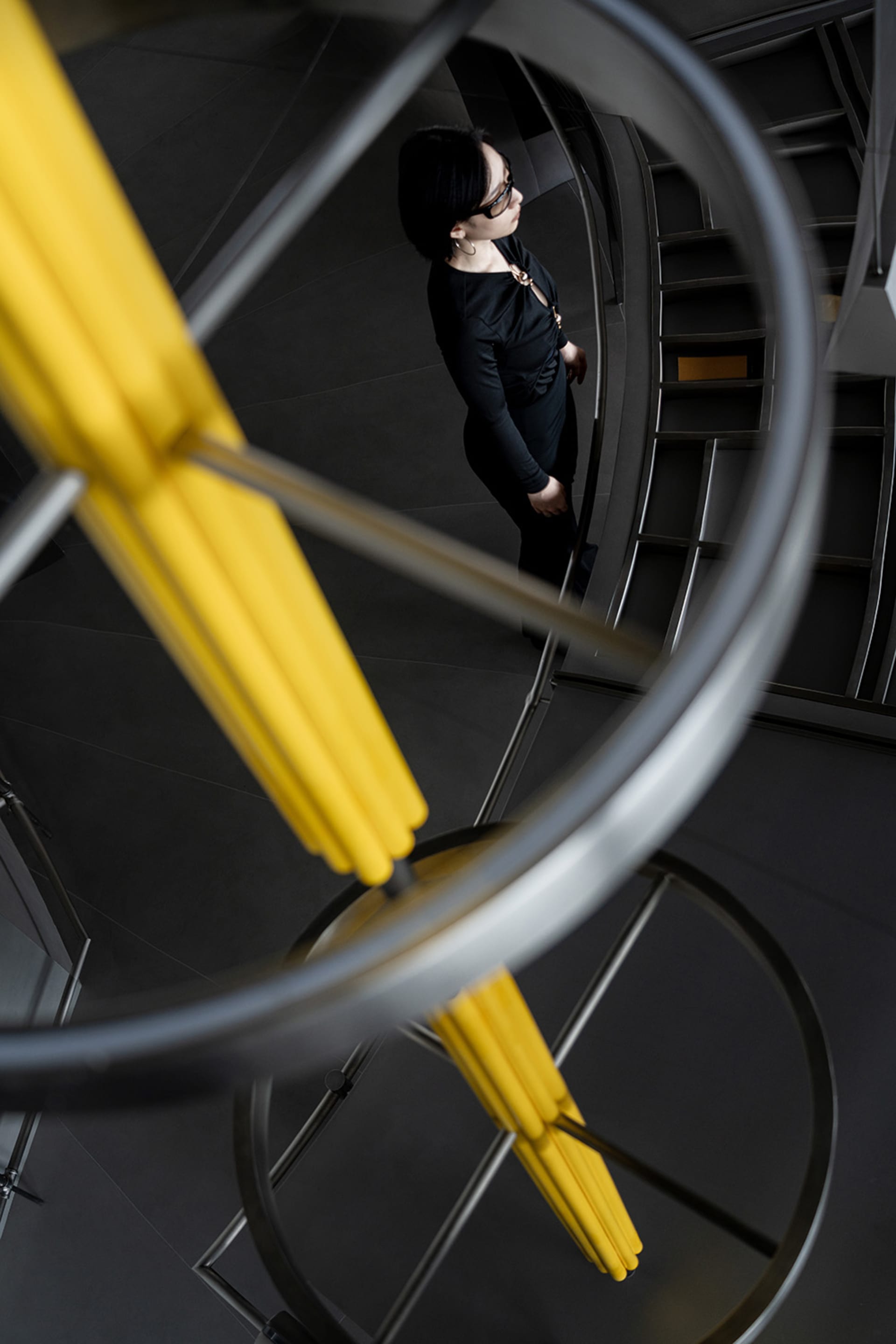 A minimalist interior design featuring metal rings.