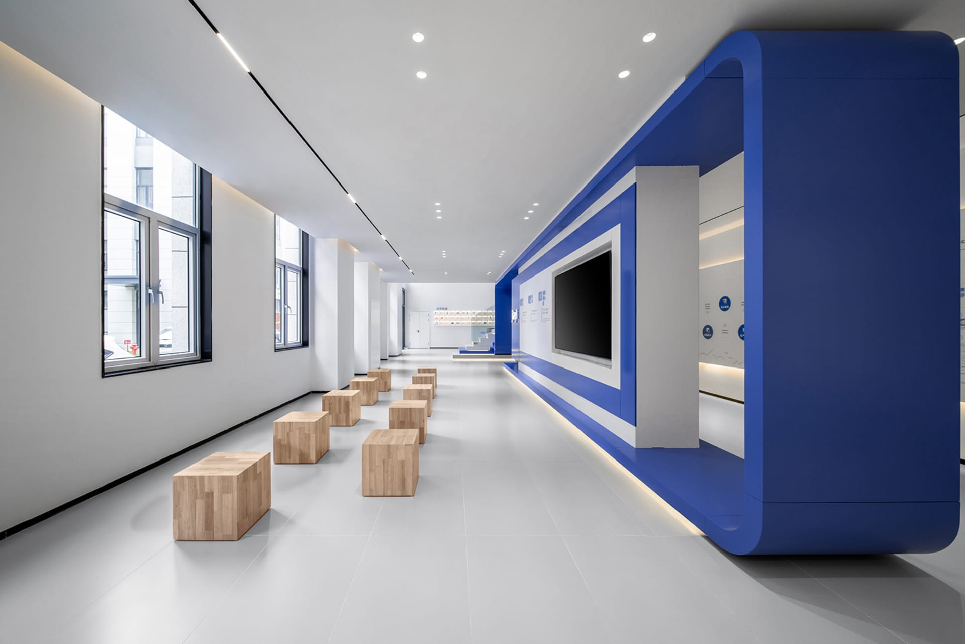 A modern office space featuring blue and white design elements.