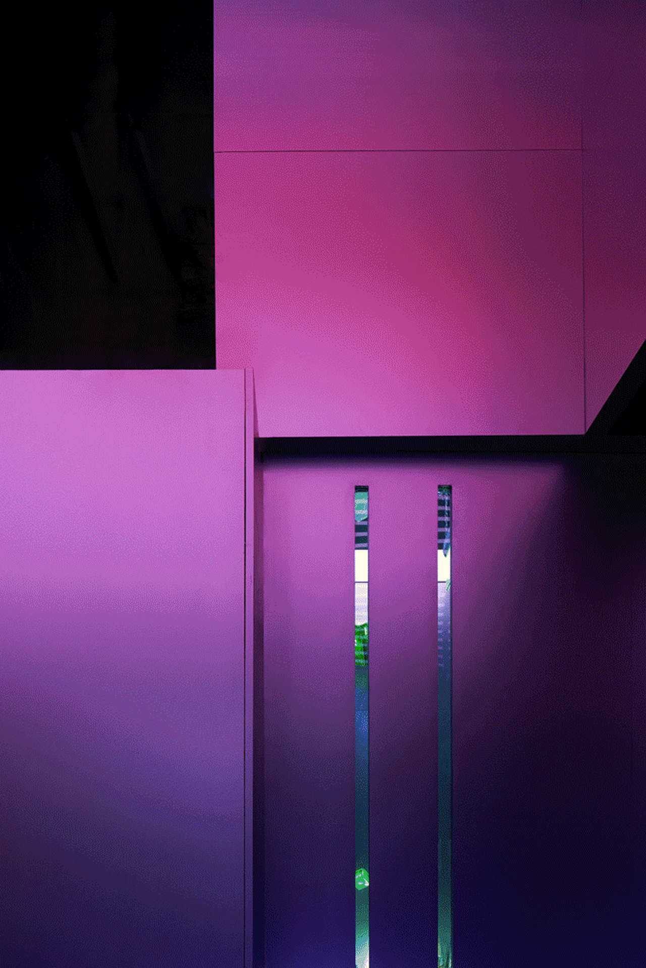 A modern interior space featuring tall glass vertical columns.