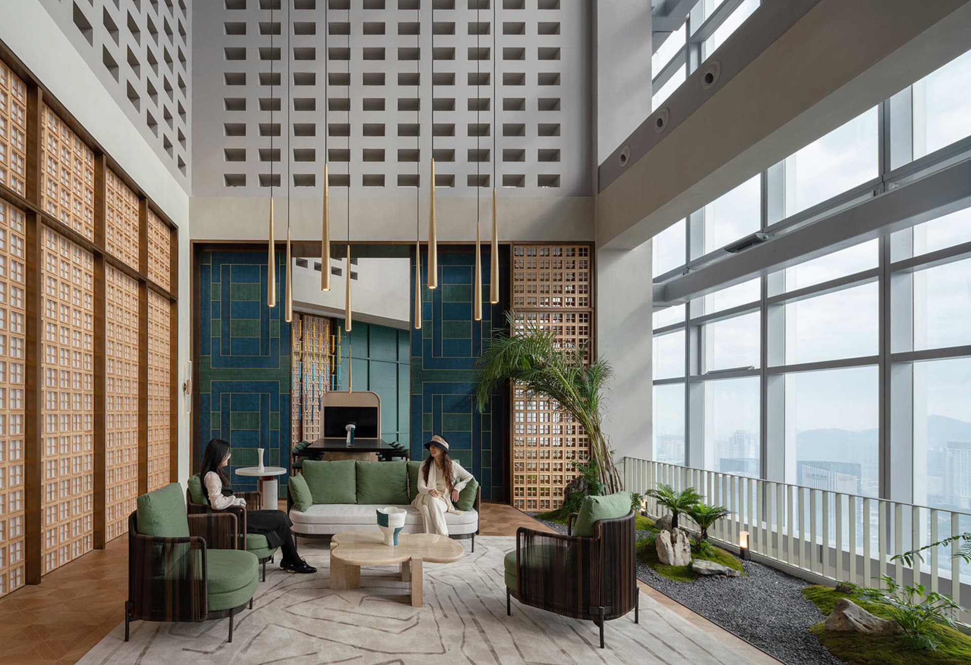 Luxurious lobby interior with modern design elements, featuring high ceilings, floor-to-ceiling windows, and comfortable seat