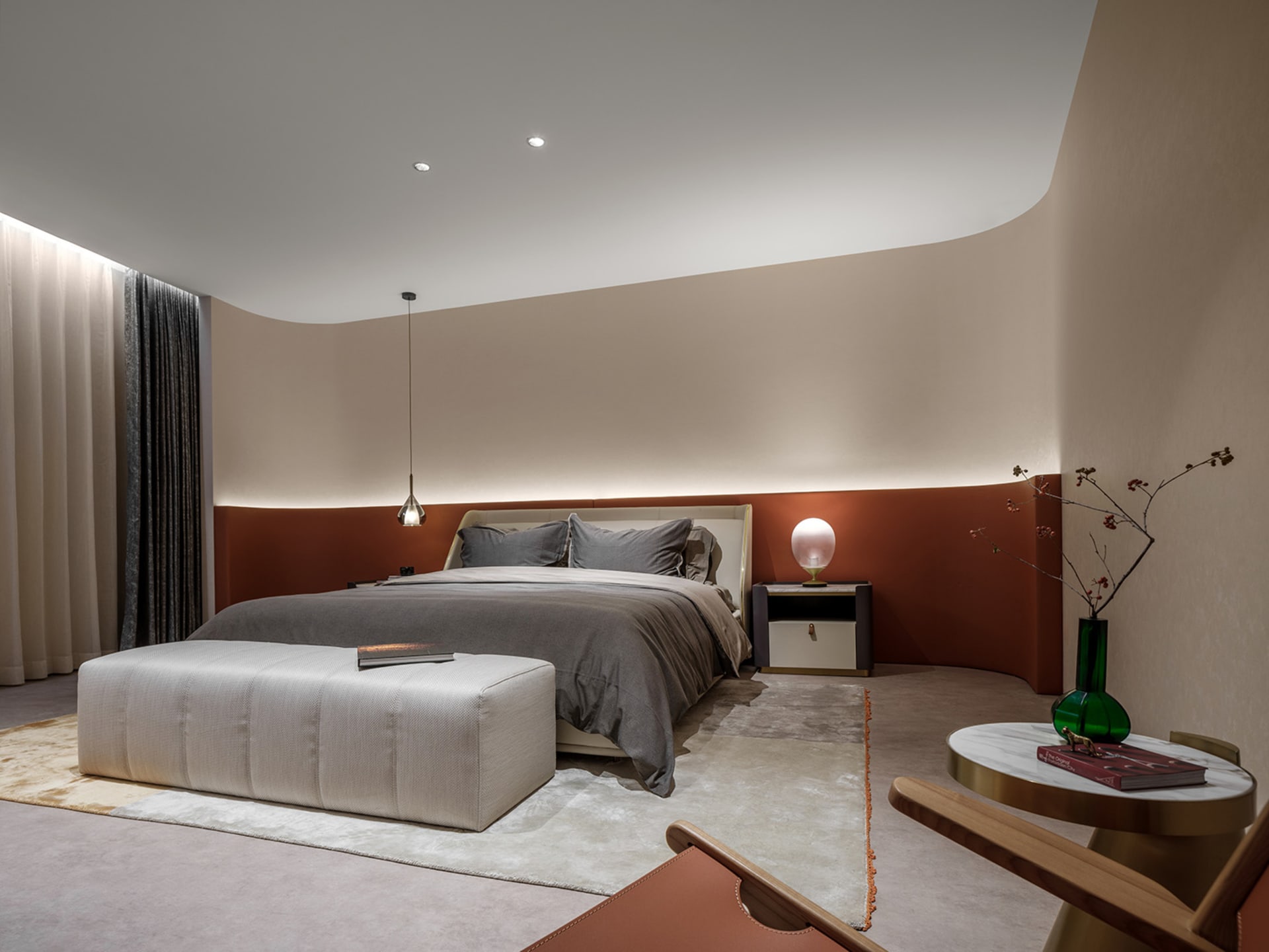Modern bedroom interior with a bed, ottoman, and side table.