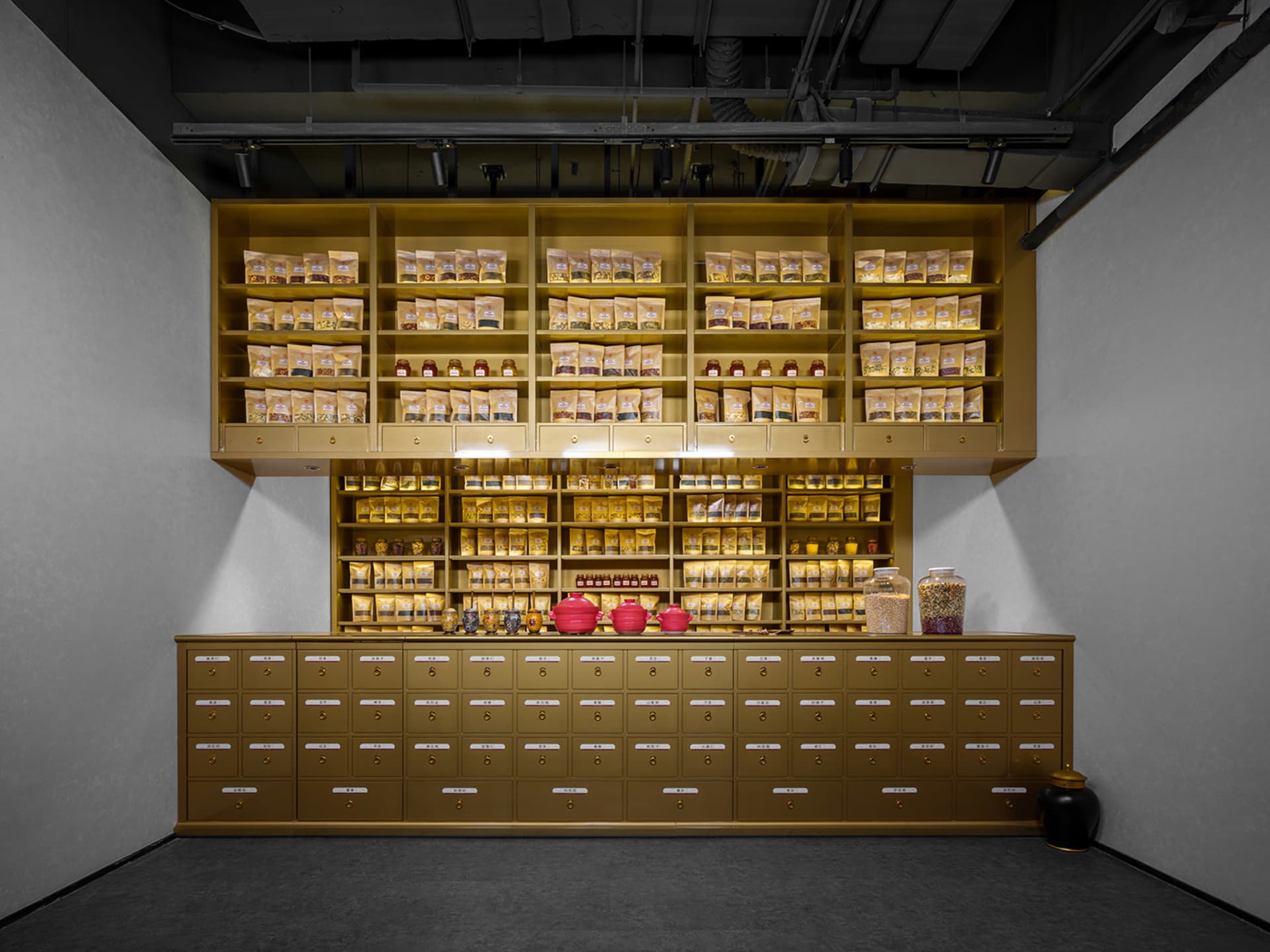 A modern retail interior featuring wooden storage units filled with various goods.
