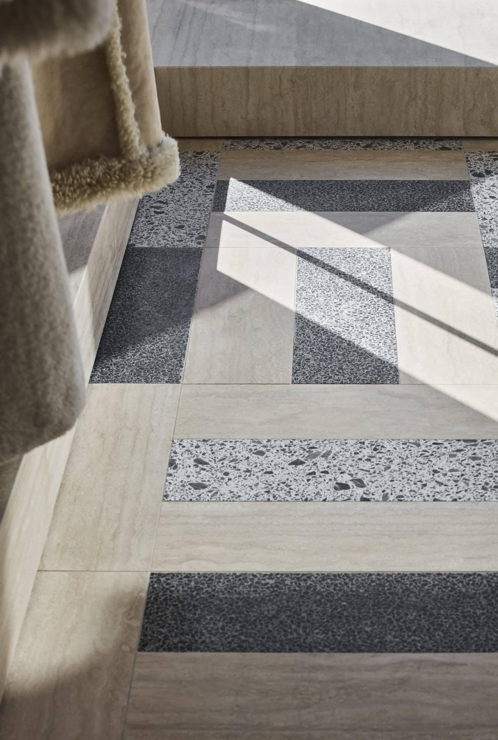 Modern floor pattern featuring concrete tile with varied textures and colors.