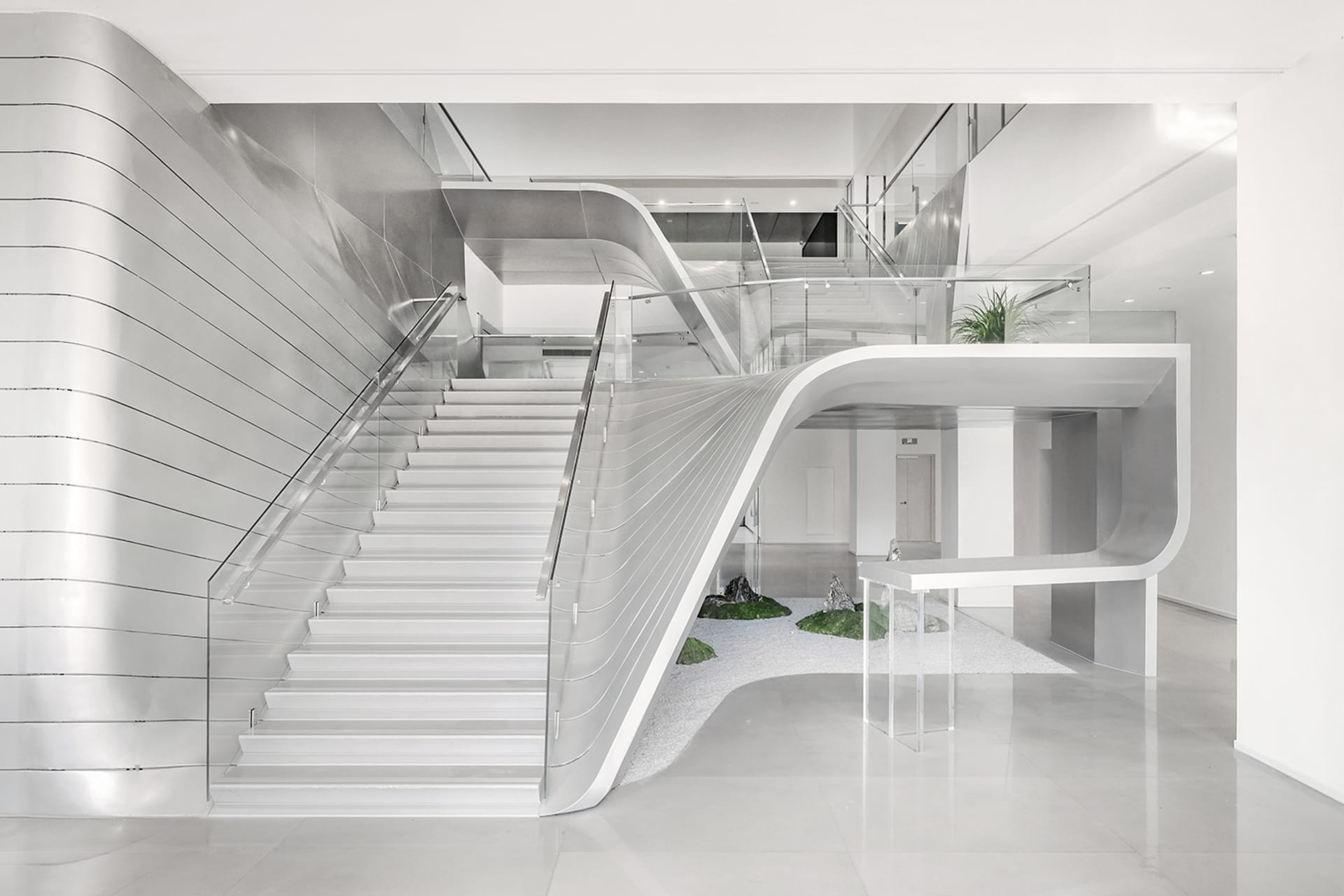 White, metal, and glass modern interior design with concrete elements