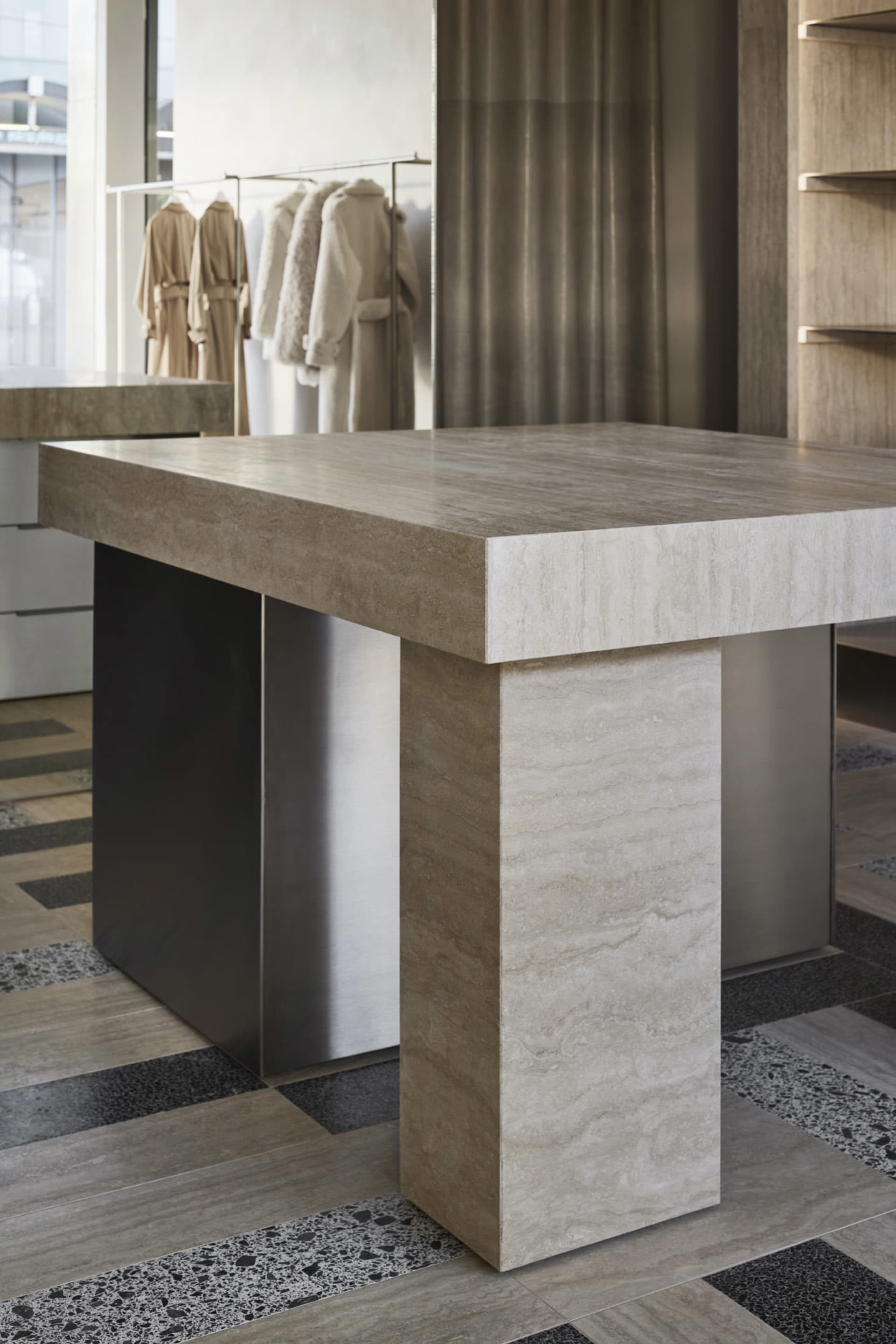 Modern console table made of marble in a contemporary interior design setting.