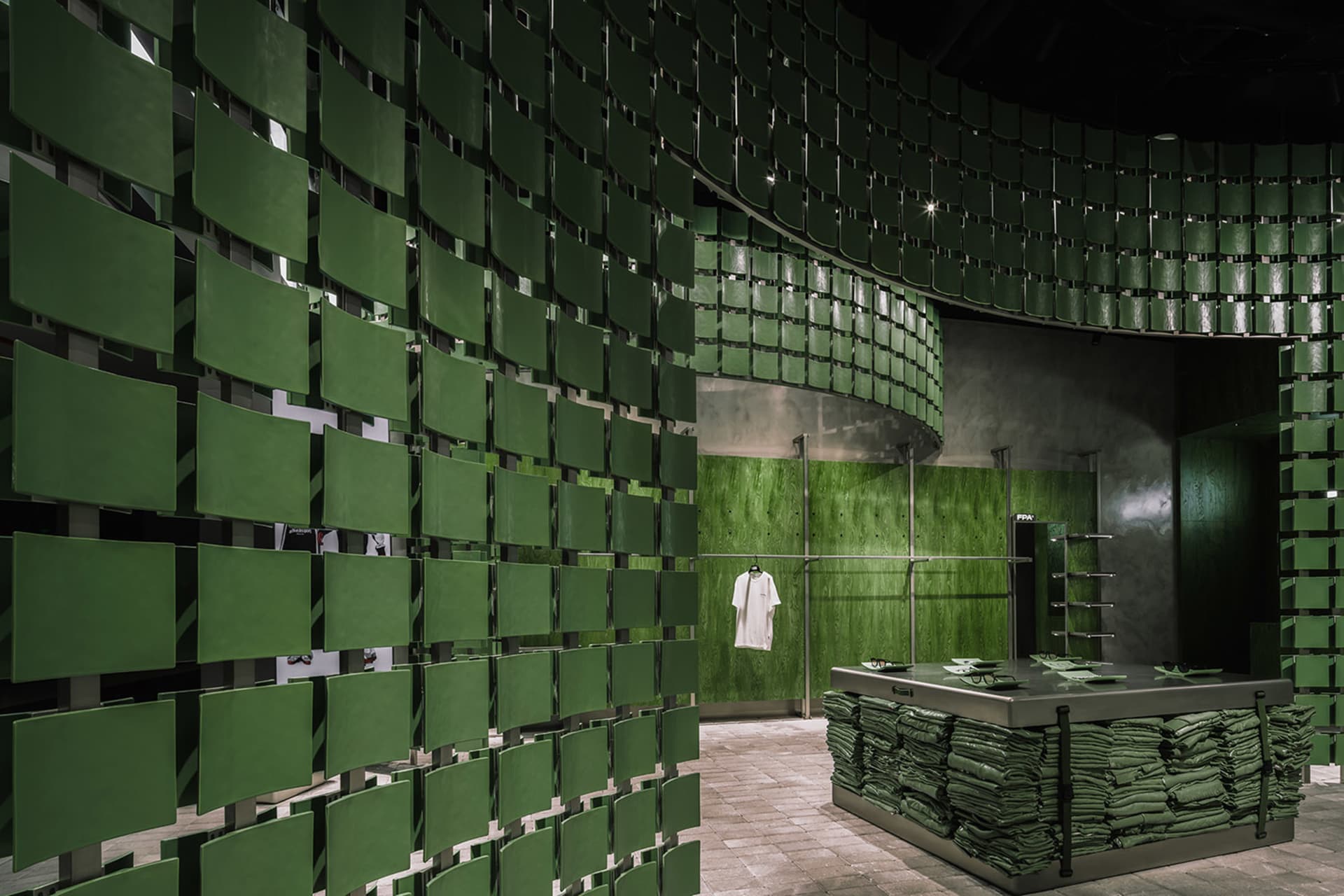 A store interior with industrial green metal panels
