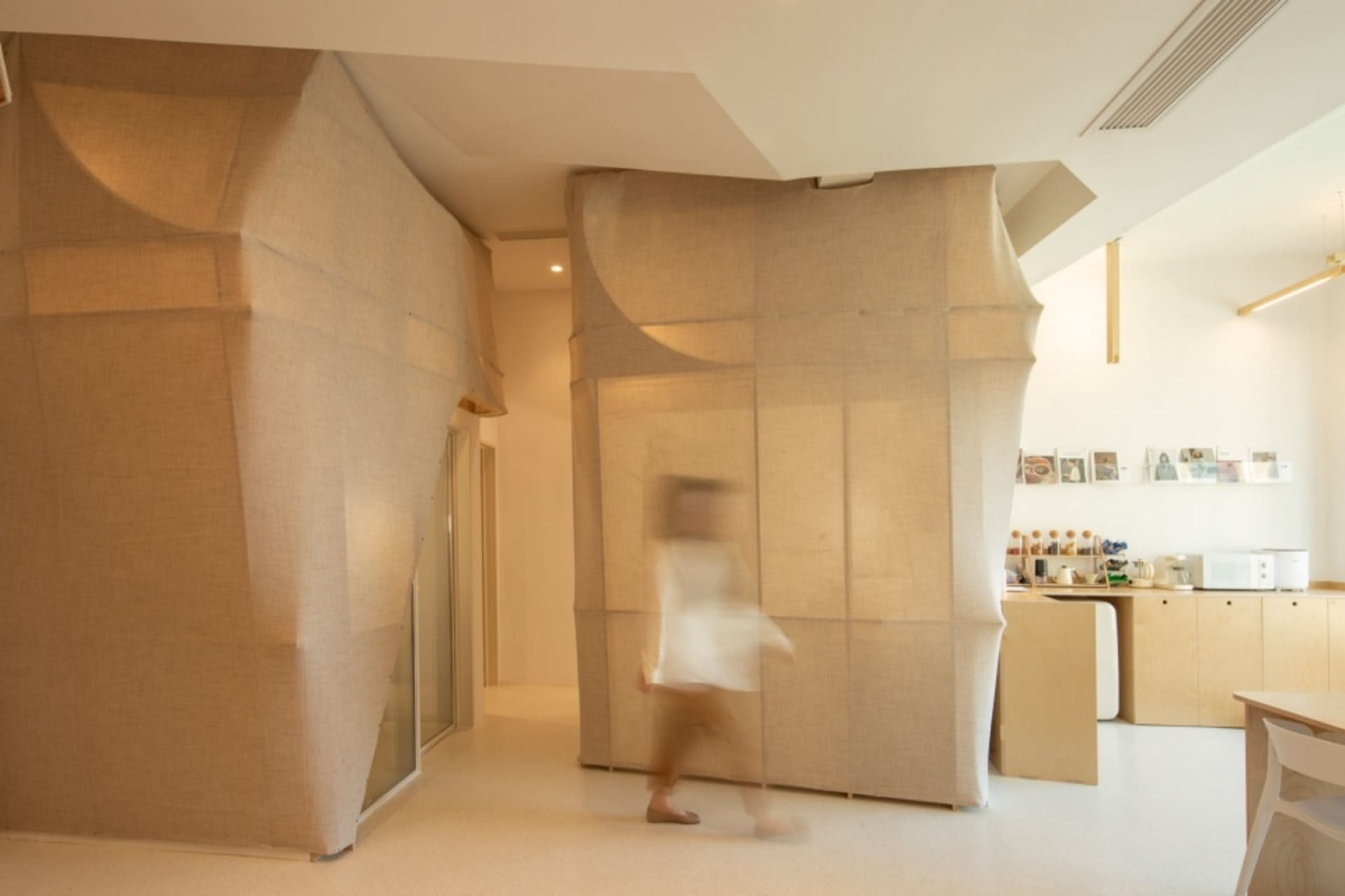 A minimalist interior with textured fabric walls