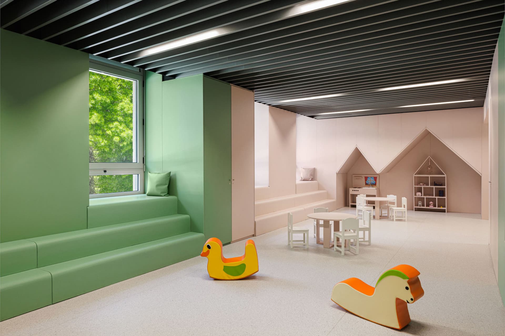 A minimalist playroom with wooden furniture, foam seating, and metal accents.