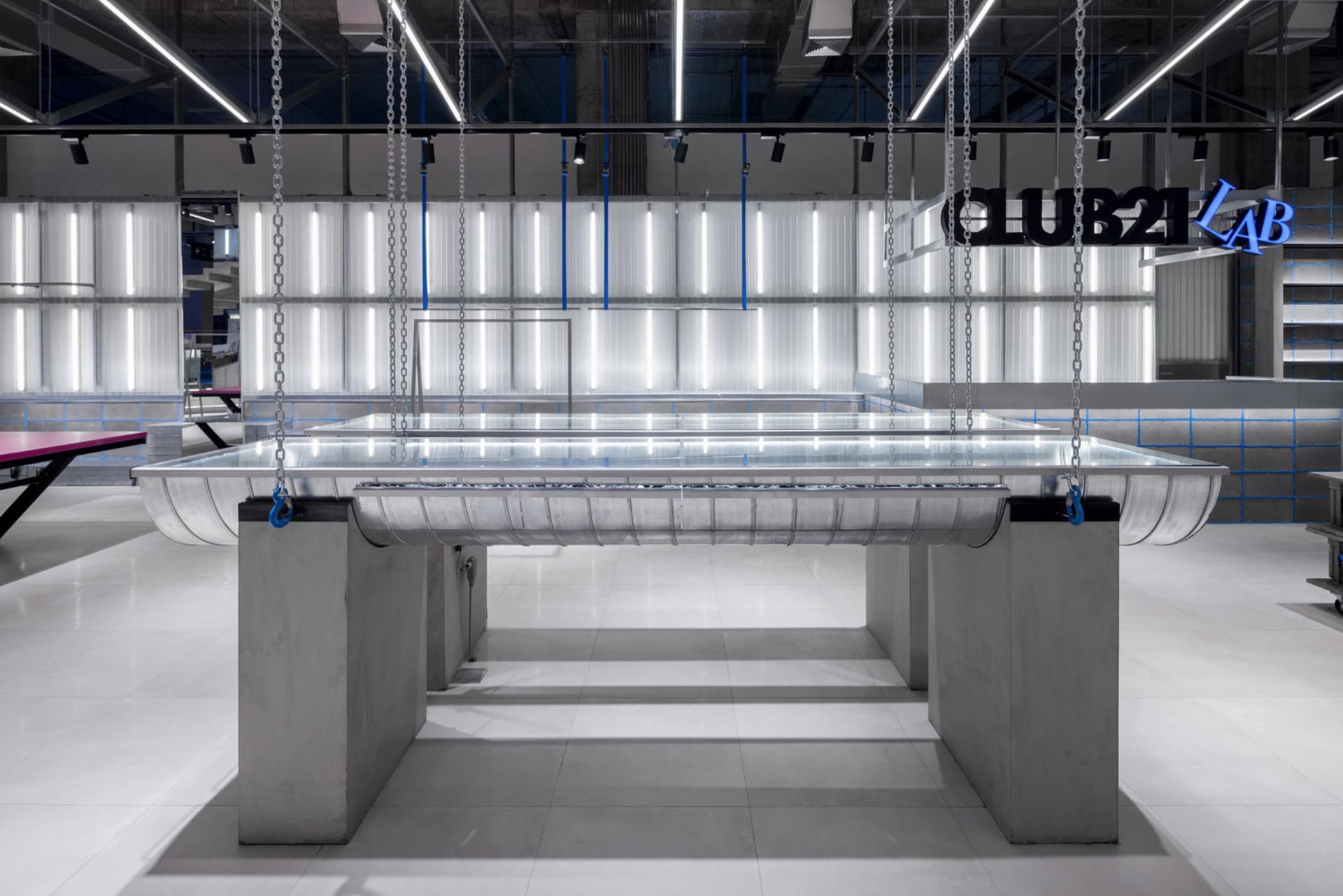 Industrial interior design featuring concrete materials in a spacious and modern setting.