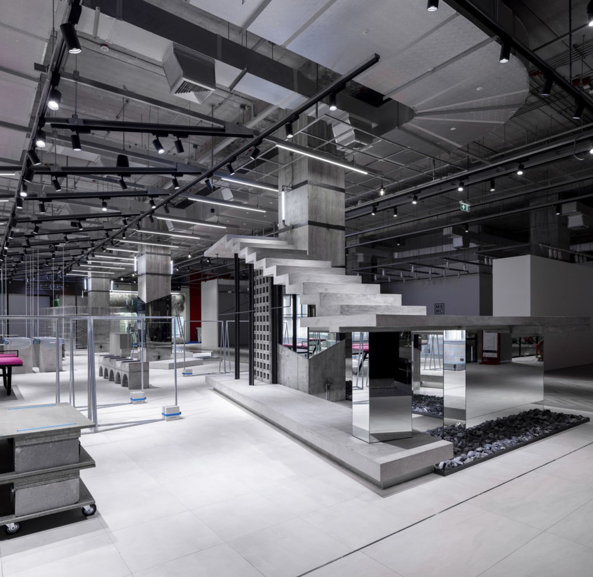 Modern office with concrete finishes and sleek, minimalist design.