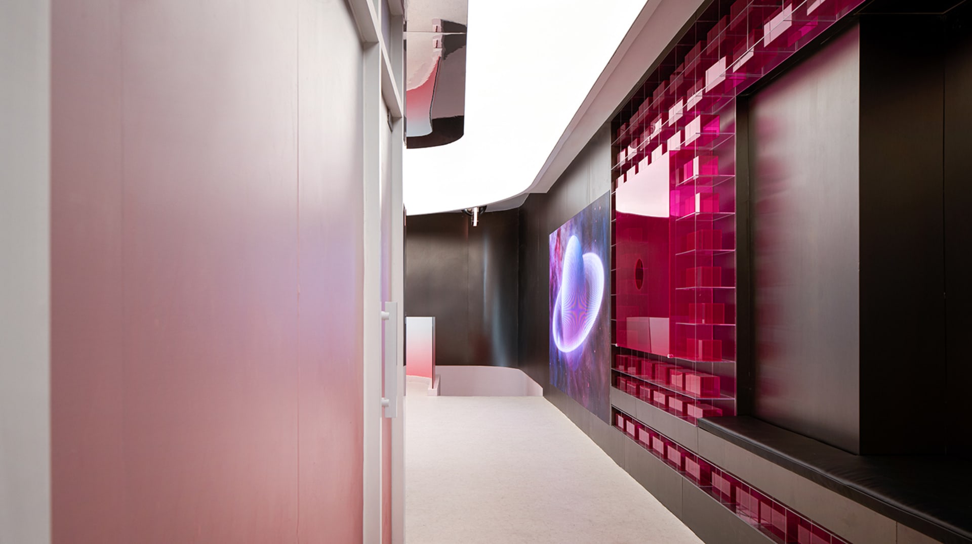 A digital space display featuring vibrant pink and purple colors and geometric patterns.