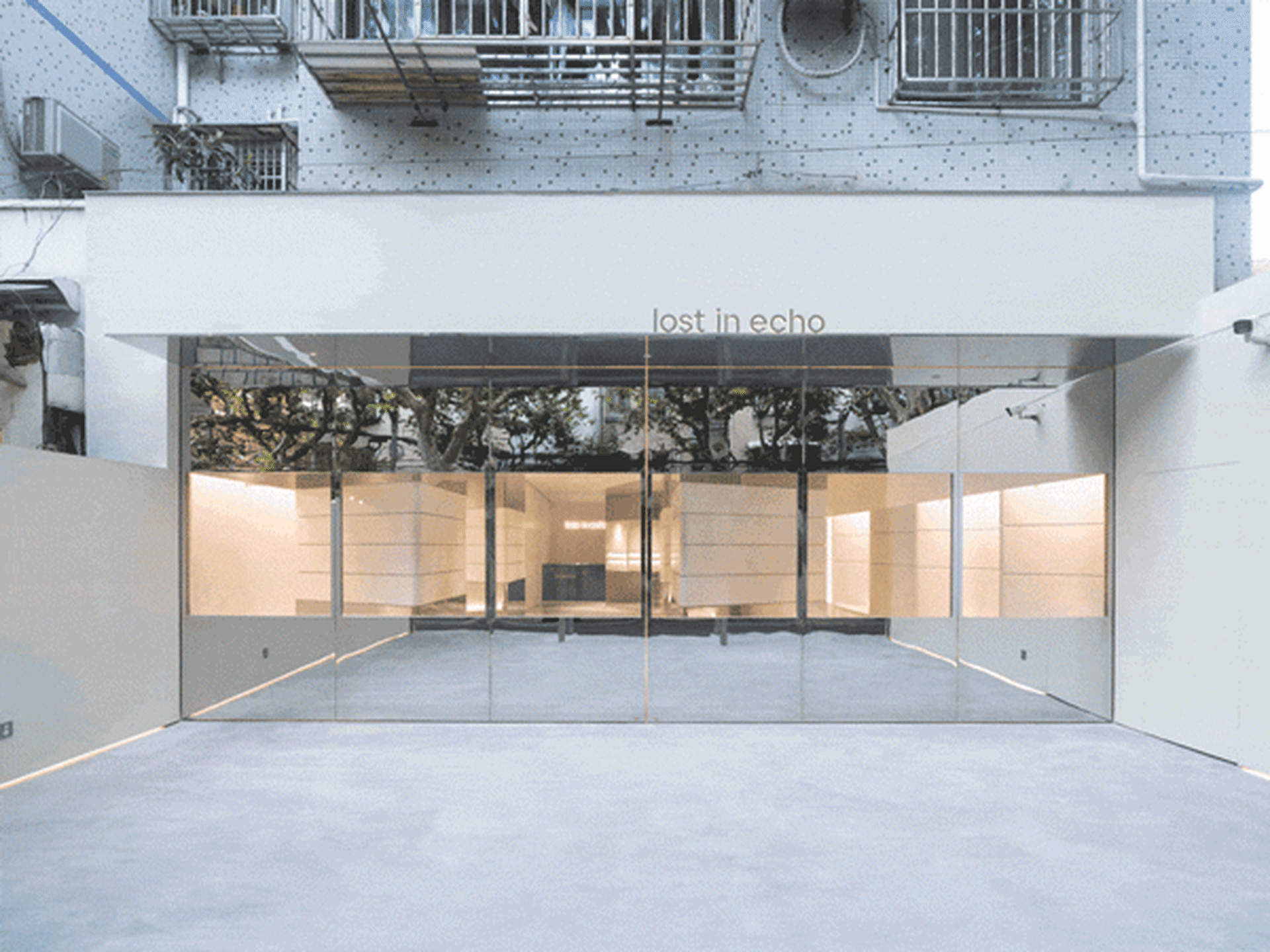 Modern glass storefront with a minimalist design