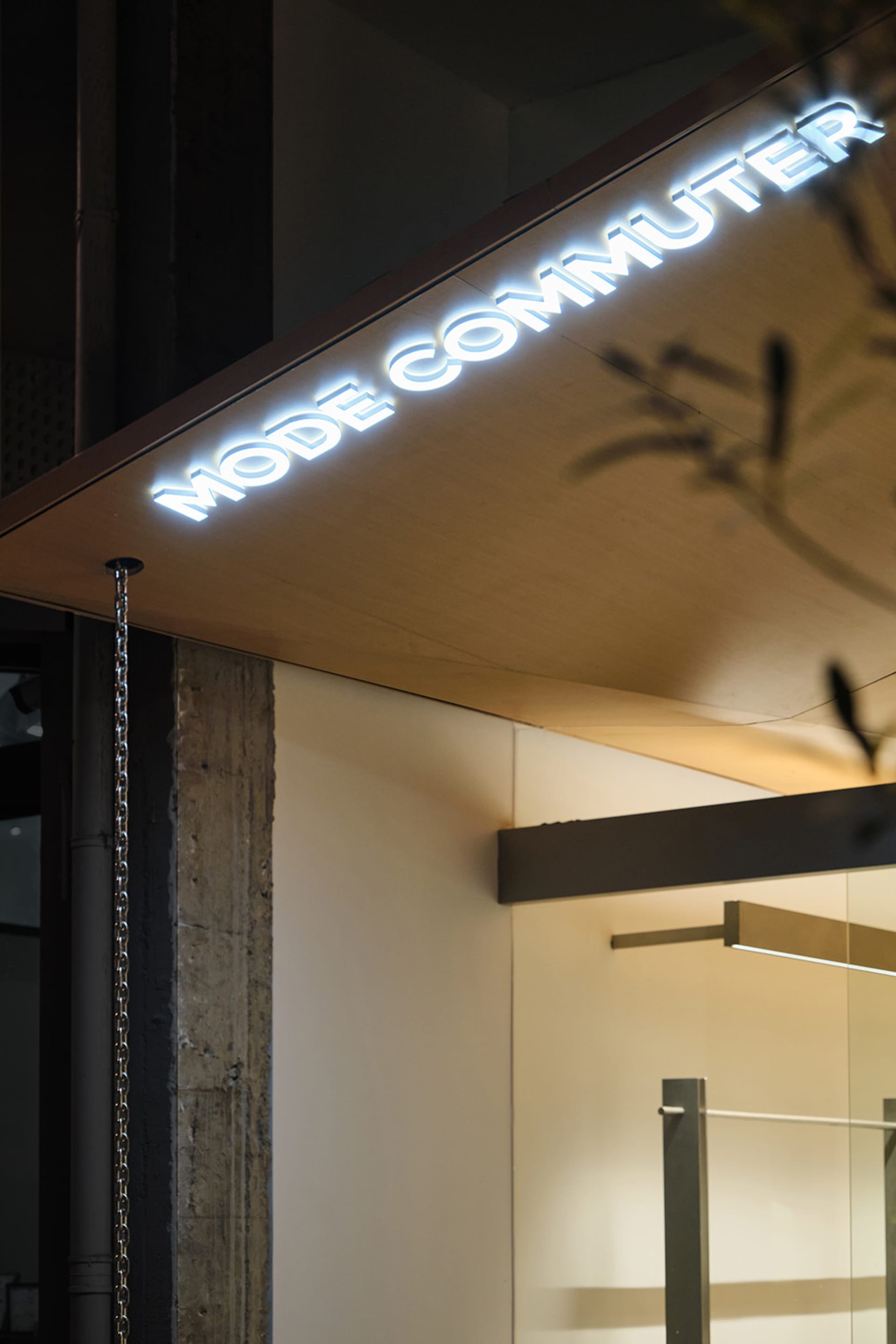 Modern storefront signage featuring metallic letters