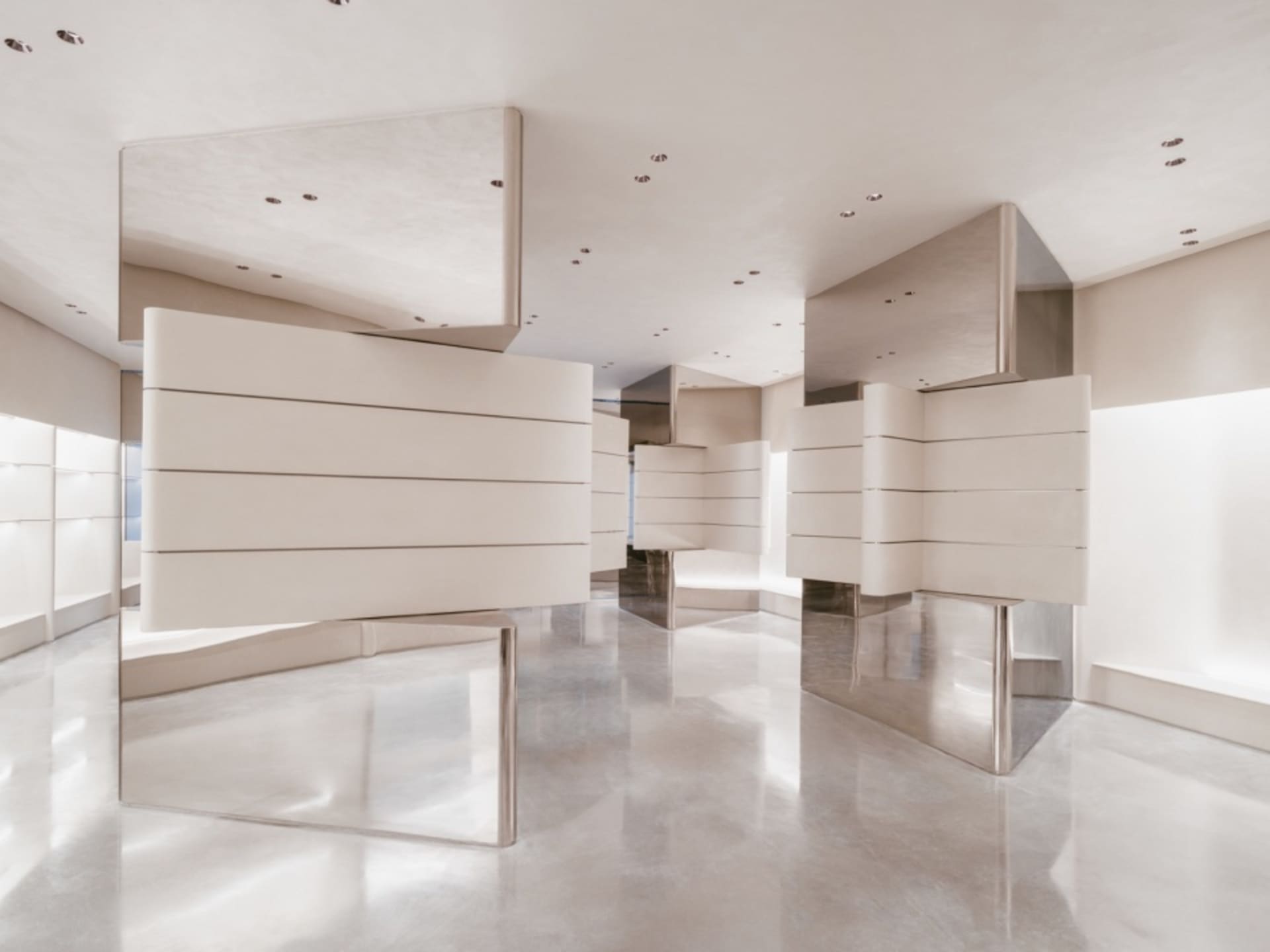 A sleek, modern storefront featuring metallic surfaces and minimalist design.